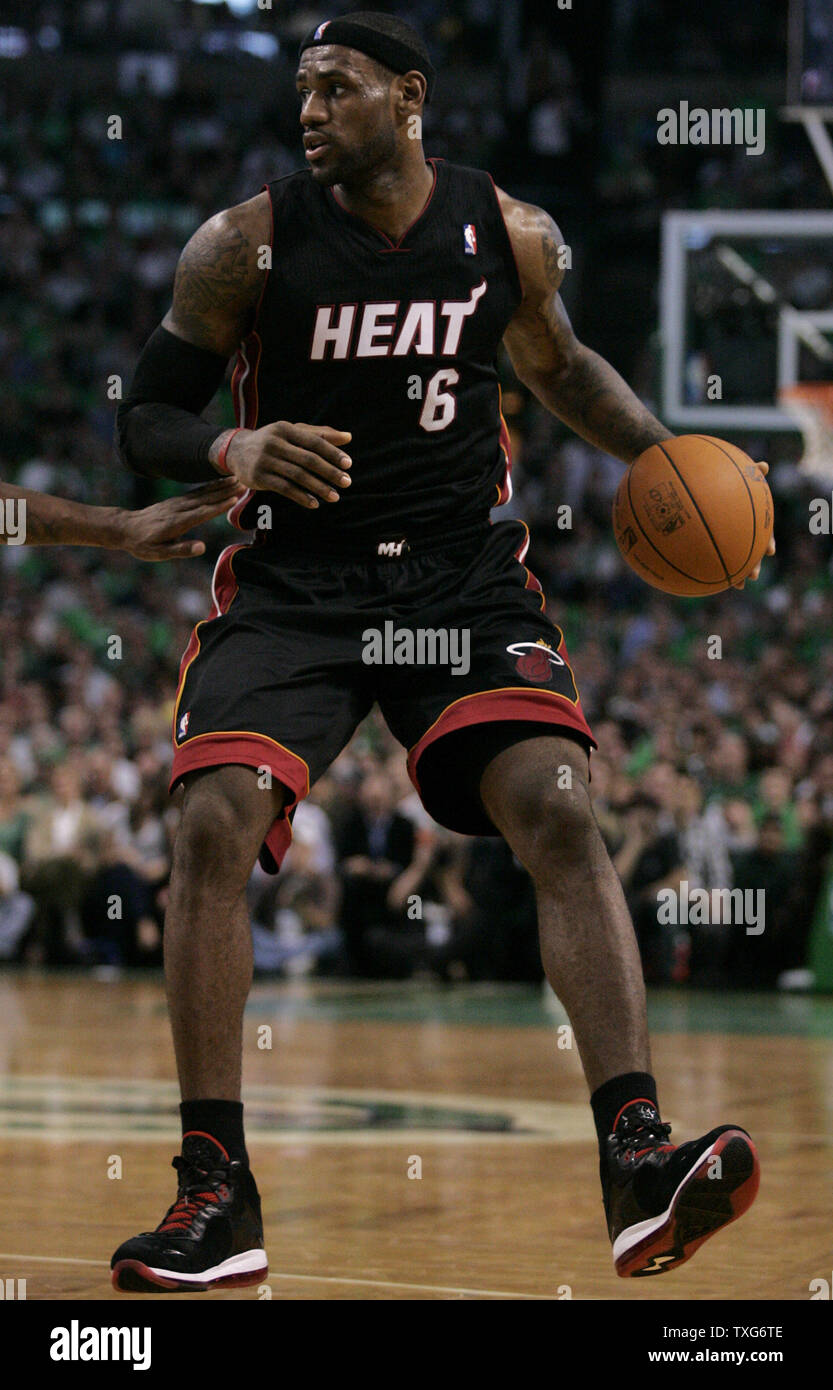 Miami Heat forward LeBron James (6) dribbles the ball in the second half of  the opening night game against the Boston Celtics at the TD Garden in  Boston, Massachusetts on October 26