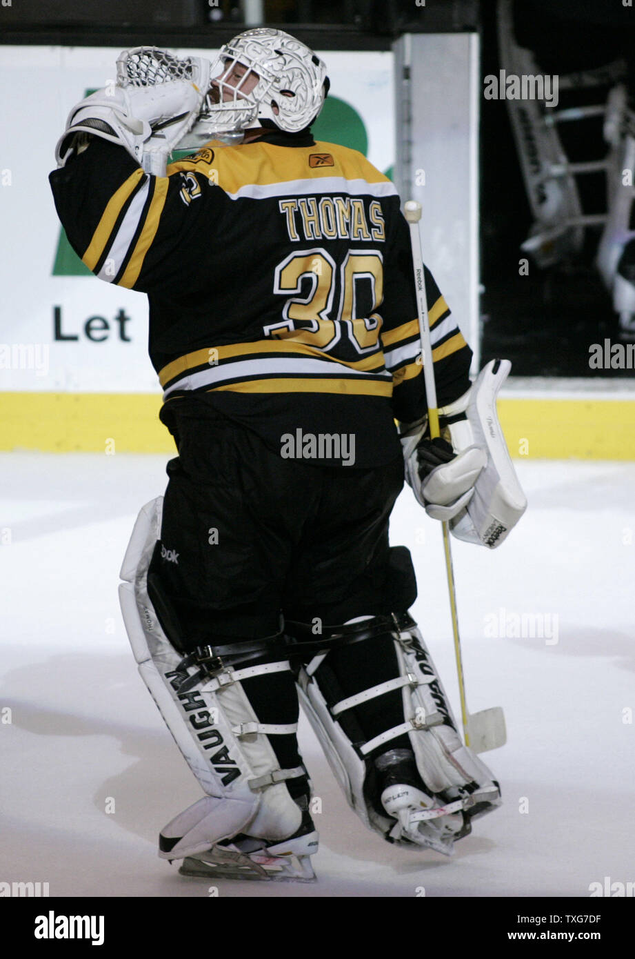 Boston Bruins goaltender Tim Thomas (30) gives a hug to center Gregory  Campbell after the Bruins defeated the Vancouver Canucks 4-0 in game four  of the Stanley Cup Final at TD Garden