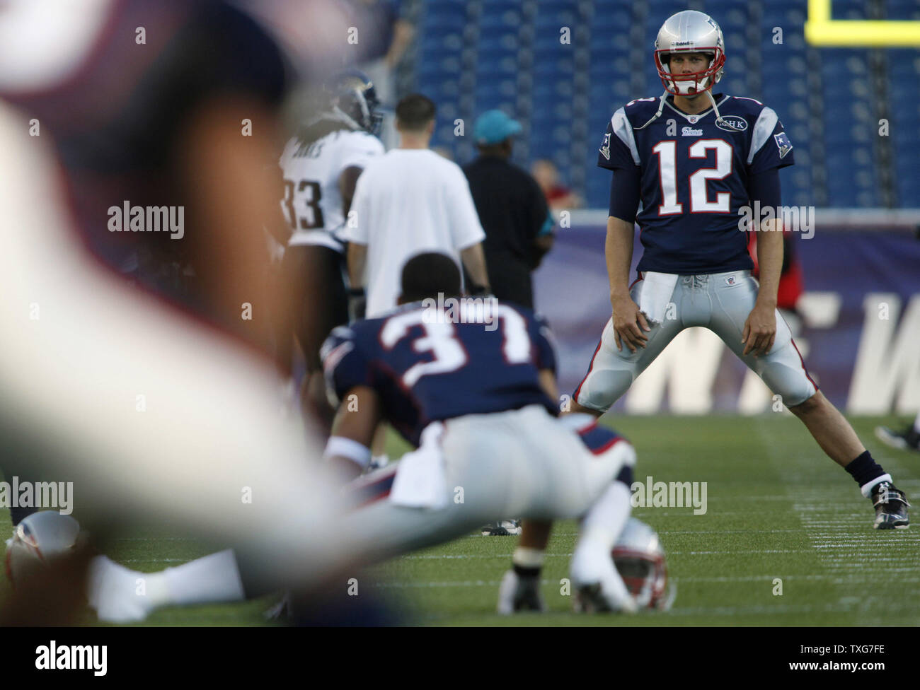 New England Patriots quarterback Tom Brady (12) warms up with his team before a preaseason game against the Jacksonville Jaguars at Gillette Stadium in Foxboro, Massachusetts on August 11, 2011.  UPI/Matthew Healey Stock Photo