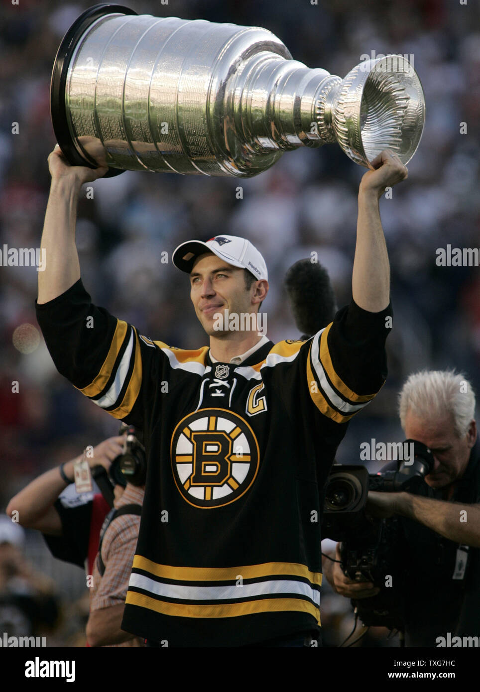 Boston Bruins captain, Zdeno Chara, hoists the Stanley Cup for the crowd before the New England Patriots took on the New York Jets at Gillette Stadium in Foxboro, Massachusetts on October 9, 2011.    UPI/Matthew Healey Stock Photo
