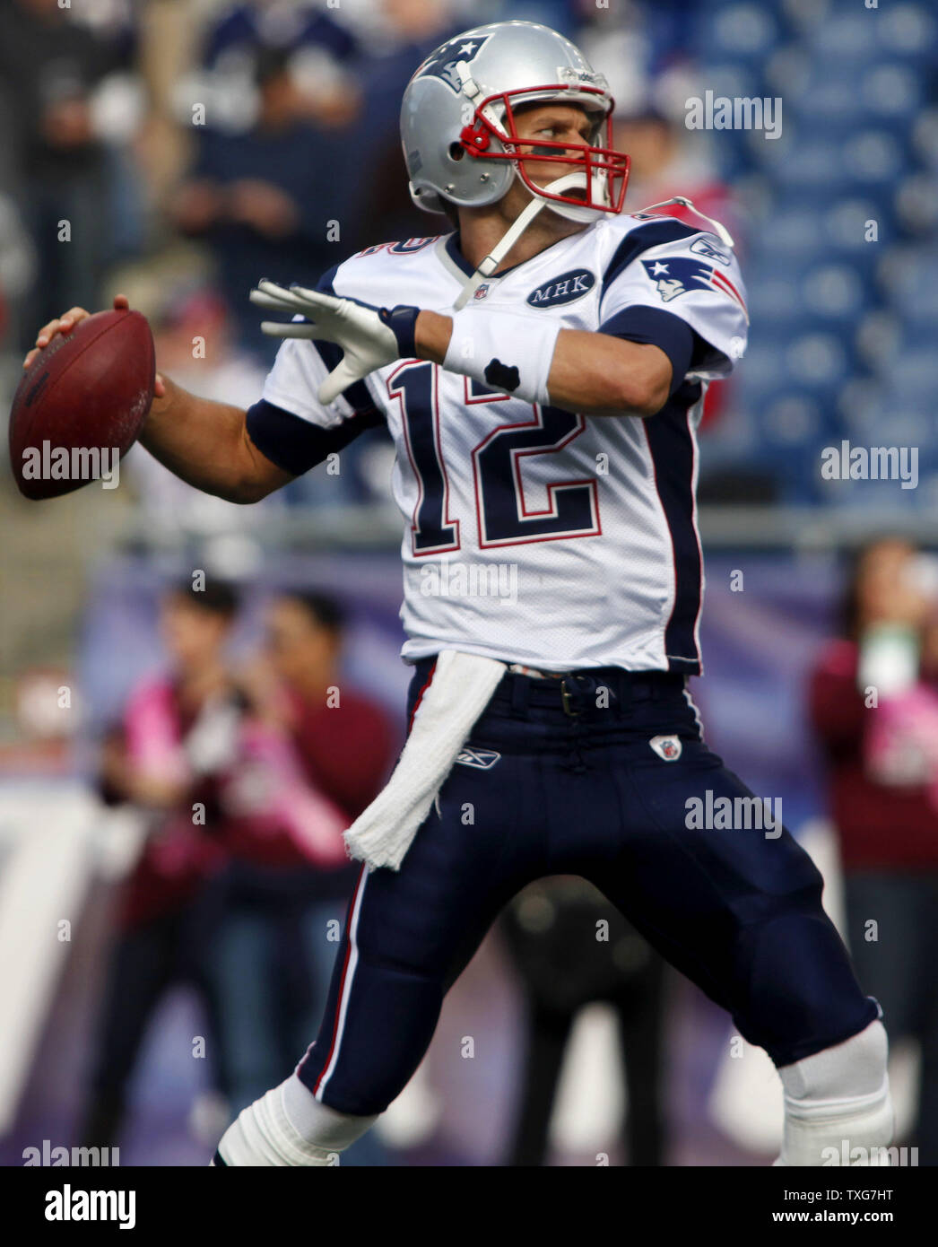 New England Patriots quarterback Tom Brady throws a pass while warming up with teammates before the game against the Dallas Cowboys at Gillette Stadium in Foxboro, Massachusetts on October 16, 2011.    UPI/Matthew Healey Stock Photo