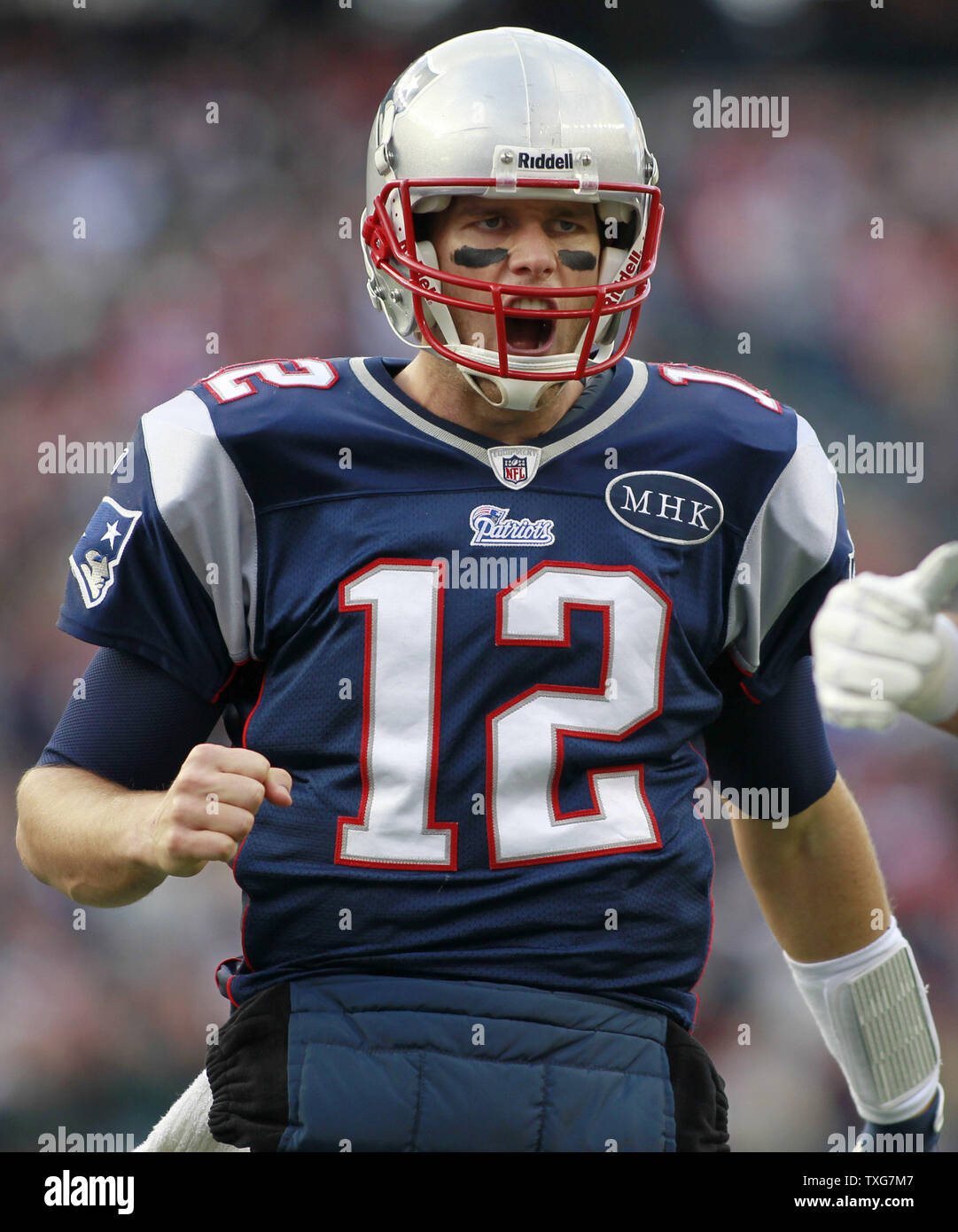 New England Patriots quarterback Tom Brady (12) celebrates a one yard touchdown by running back BenJarvus Green-Ellis in the second quarter against the Indianaoplis Colts at Gillette Stadium in Foxboro, Massachusetts on December 4, 2011.     UPI/Matthew Healey Stock Photo