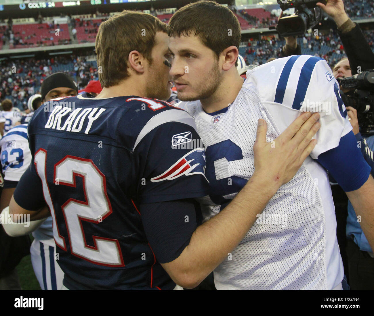 New England Patriots quarterback Tom Brady (12) hugs Indianapolis Colts quarterback Dan Orlovsky (6) after the game at Gillette Stadium in Foxboro, Massachusetts on December 4, 2011.  The Patriots defeated the Colts UPI/Matthew Healey Stock Photo