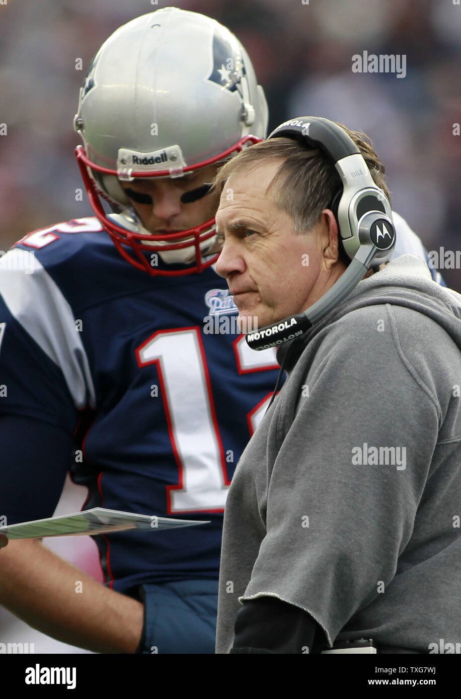New England Patriots quarterback Tom Brady (12) confers with head coach Bill Belichick (R) in the first quarter against the Indianapolis Colts at Gillette Stadium in Foxboro, Massachusetts on December 4, 2011.  The Patriots defeated the Colts UPI/Matthew Healey Stock Photo