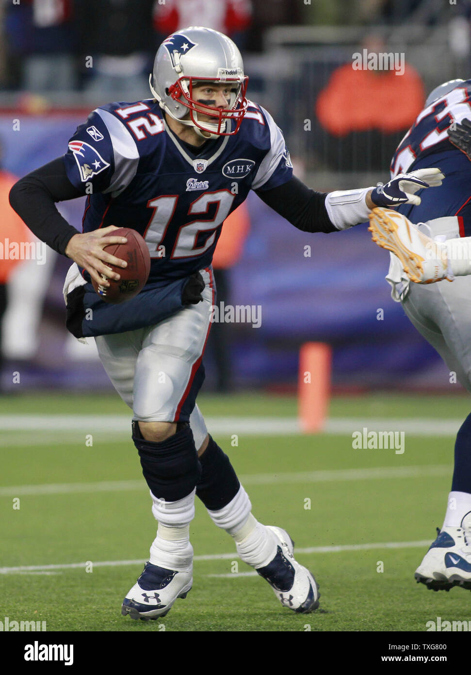 New England Patriots quarterback Tom Brady scrambles in the fourth quarter against the Miami Dolphins at Gillette Stadium in Foxboro, Massachusetts on December 24, 2011.  The Patriots defeated the Dolphins 27-24.     UPI/Matthew Healey Stock Photo