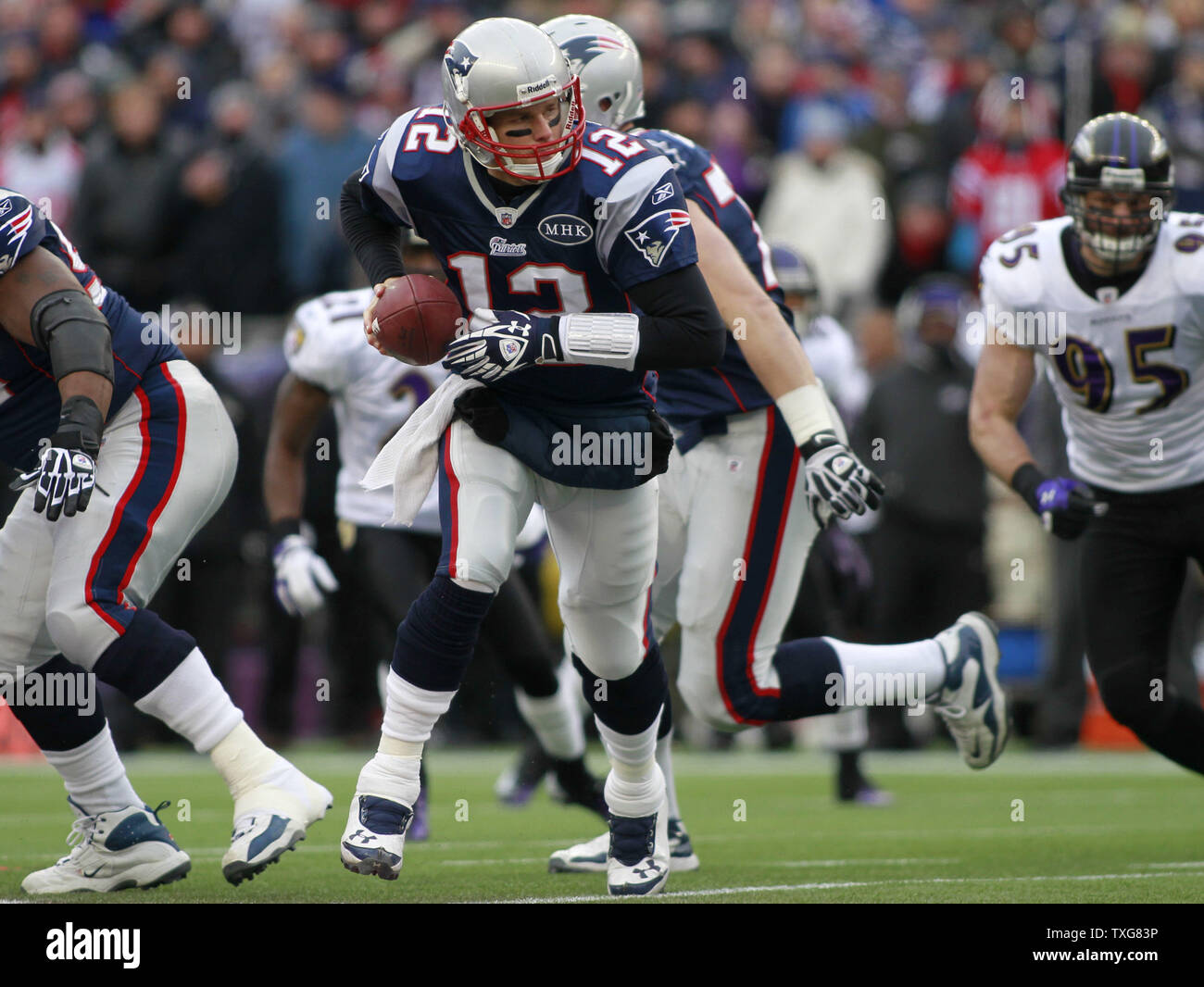 New England Patriots quarterback Tom Brady (12) rolls out for a hand off in the first quarter of the AFC Championship game against the Baltimore Ravens at Gillette Stadium in Foxboro, Massachusetts on January 22, 2012.   UPI/Matthew Healey Stock Photo