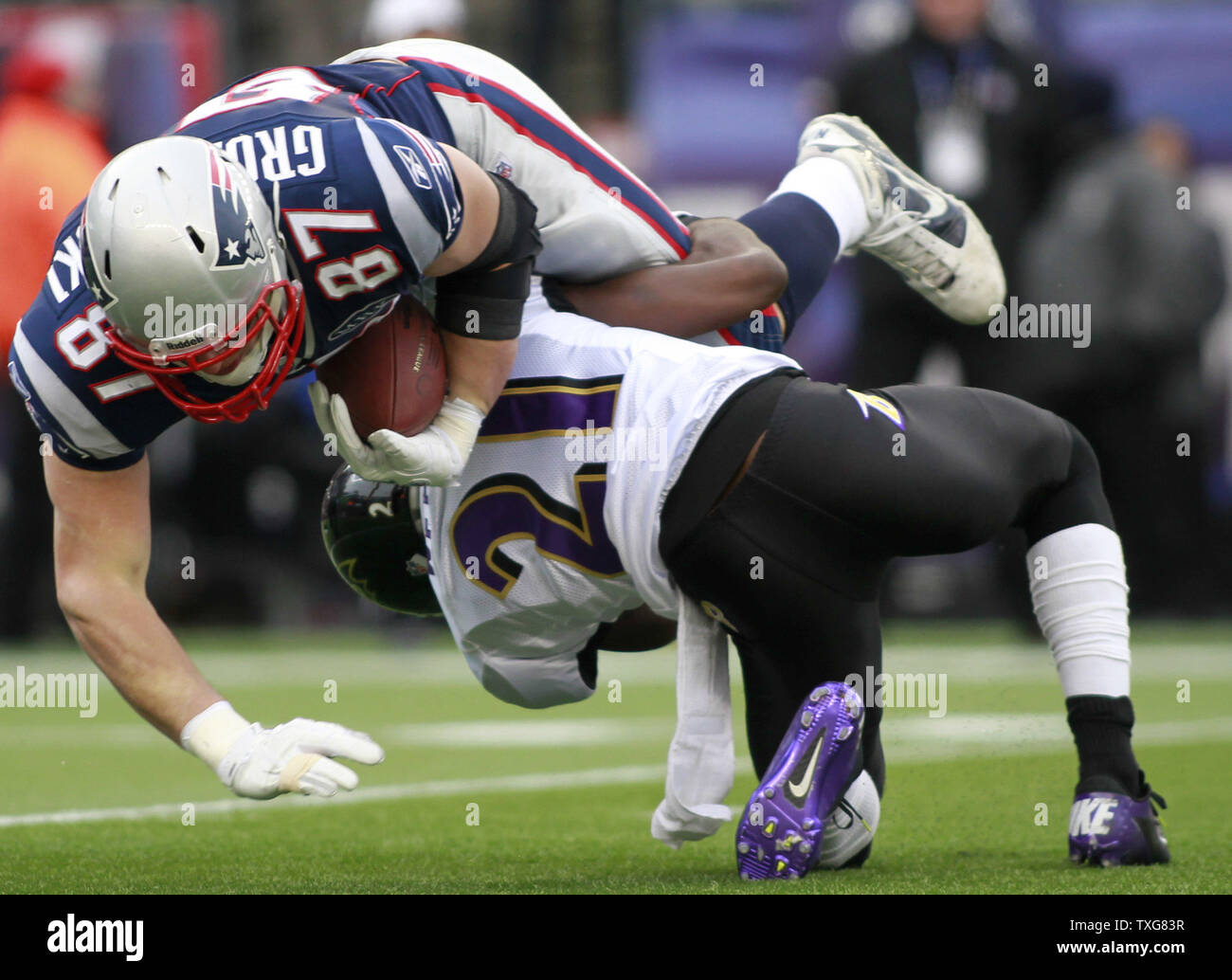 New England Patriots tight end Rob Gronkowski (87) is upended by Baltimore Ravens cornerback Lardarius Webb in on a reception in the first quarter of the AFC Championship game at Gillette Stadium in Foxboro, Massachusetts on January 22, 2012.   UPI/Matthew Healey Stock Photo