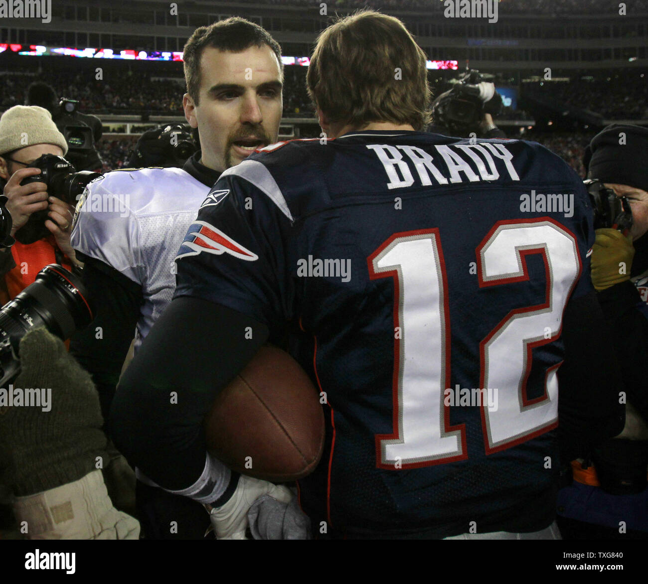 Baltimore Ravens quarterback Joe Flacco (L) shakes hands with New England Patriots quarterback Tom Brady after the Patriots defeated the Ravens to take AFC Championship at Gillette Stadium in Foxboro, Massachusetts on January 22, 2012.   UPI/Matthew Healey Stock Photo