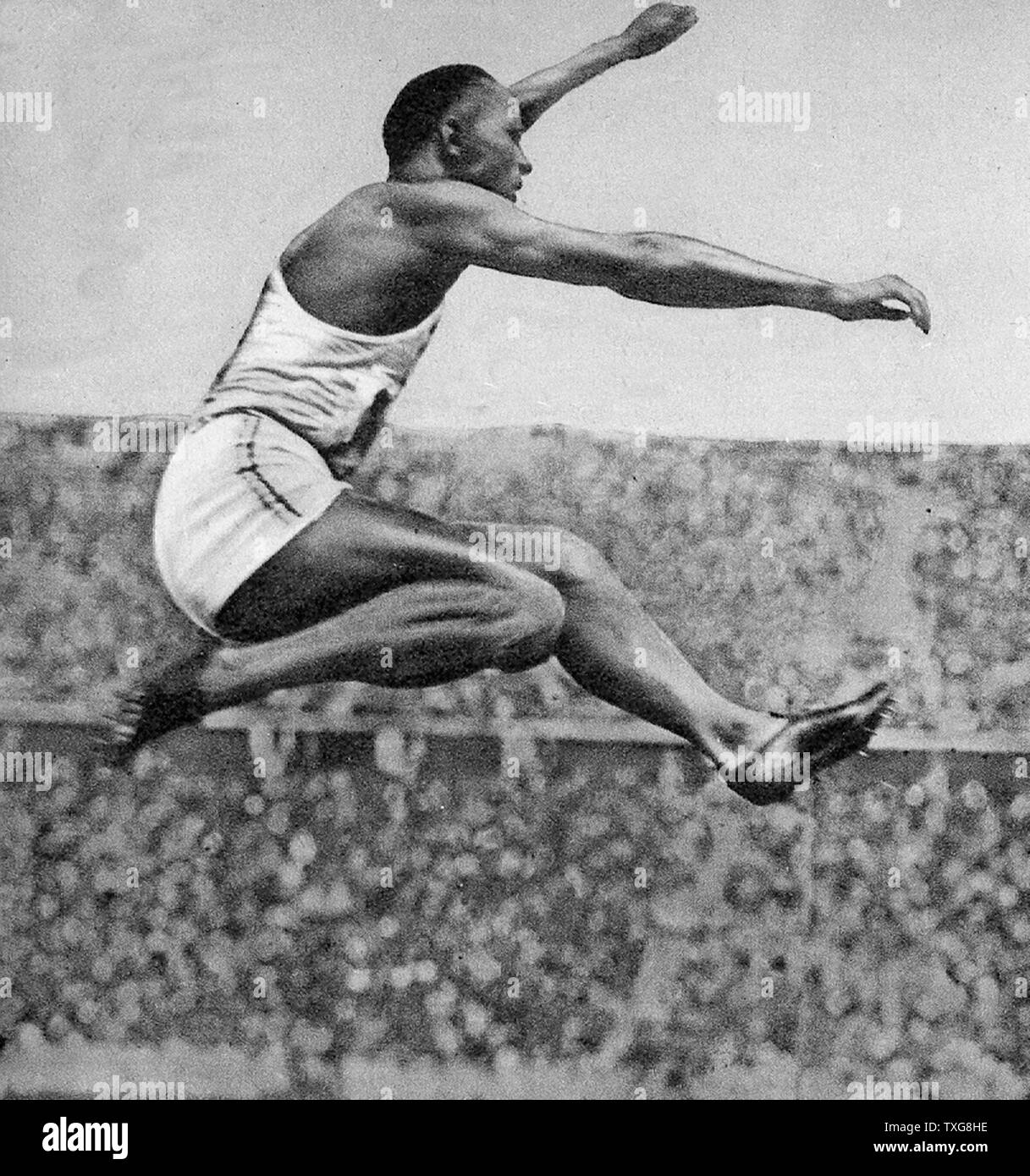 Jesse Owens, American track and field athlete. He participated in the 1936  Summer Olympics in Berlin, Germany, where he achieved international fame by  winning four gold medals Stock Photo - Alamy