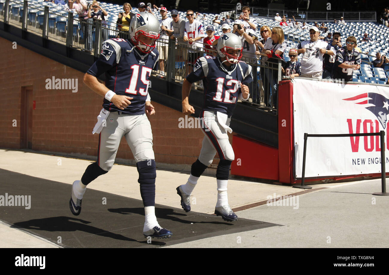 New England Patriots quarterbacks Tom Brady (12) and Ryan Mallett (15) take to the field to warm up before the game against the Arizona Cardinals at Gillette Stadium in Foxboro, Massachusetts on September 16, 2012.   UPI/Matthew Healey Stock Photo