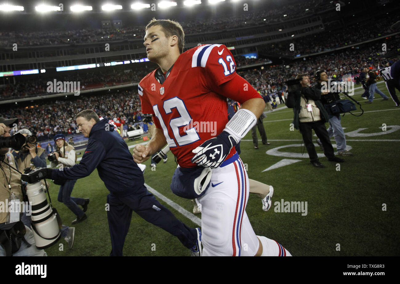 New England Patriots quarterback Tom Brady runs off the field after the Patriots defeated the New York Jets 29-26 in overtime at Gillette Stadium in Foxboro, Massachusetts on October 21, 2012.  UPI/Matthew Healey Stock Photo