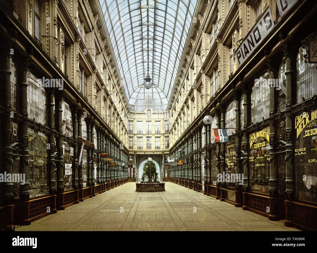 Shopping Arcade in Rotterdam - Holland (1890-1900)   Shops lining both sides of glass-roofed arcade   Netherlands   City Trade Retail Stock Photo