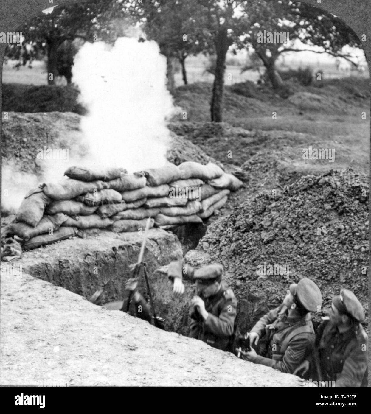 World War I   : Three British soldiers in trench under fire Stock Photo