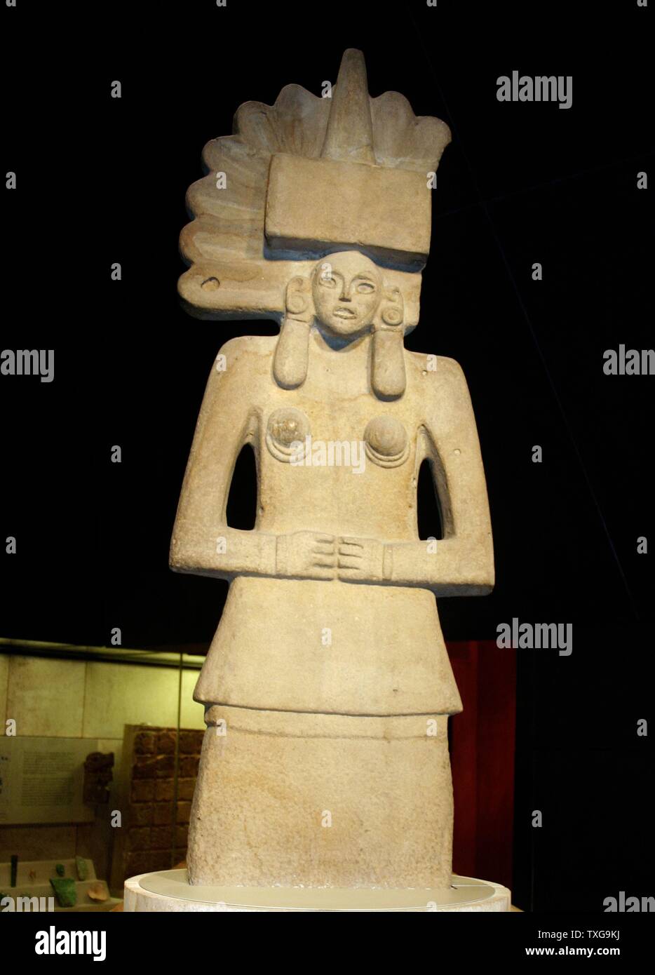 Stone sculpture of Tlazolteotl, an earth goddess associated with carnal sin Huastec culture, AD 900-1521 - Mexico Stock Photo