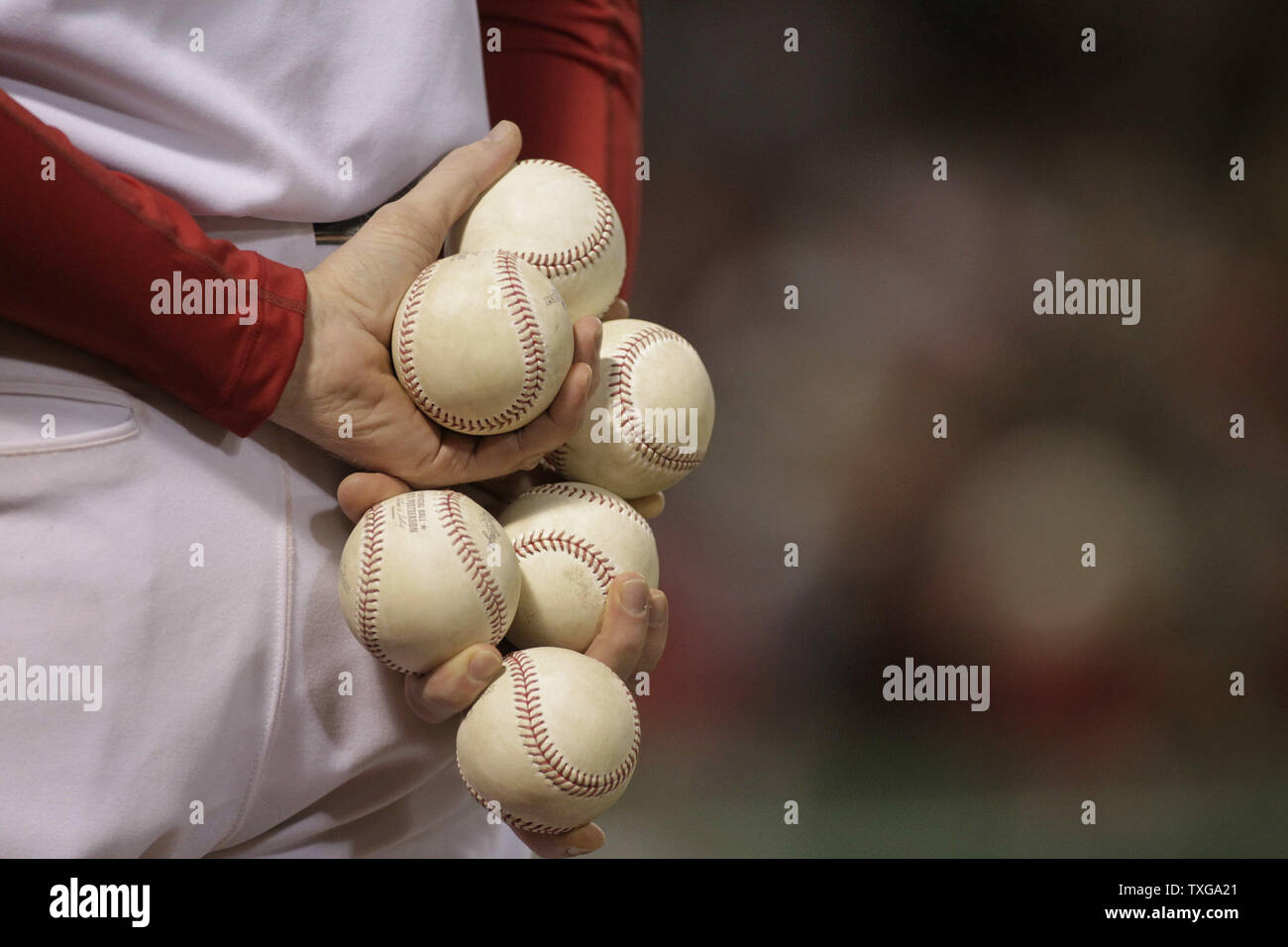 The Boston Red Sox Ball Boy Carries Six Balls In His Hands Before Game One Of The Alcs Between The Detroit Tigers And The Boston Red Sox At Fenway Park In Boston The Boston Red Sox Ball Boy Carries Six Balls In His Hands Before Game One Of The Alcs Between The Detroit Tigers And The Boston Red Sox At Fenway Park In Boston