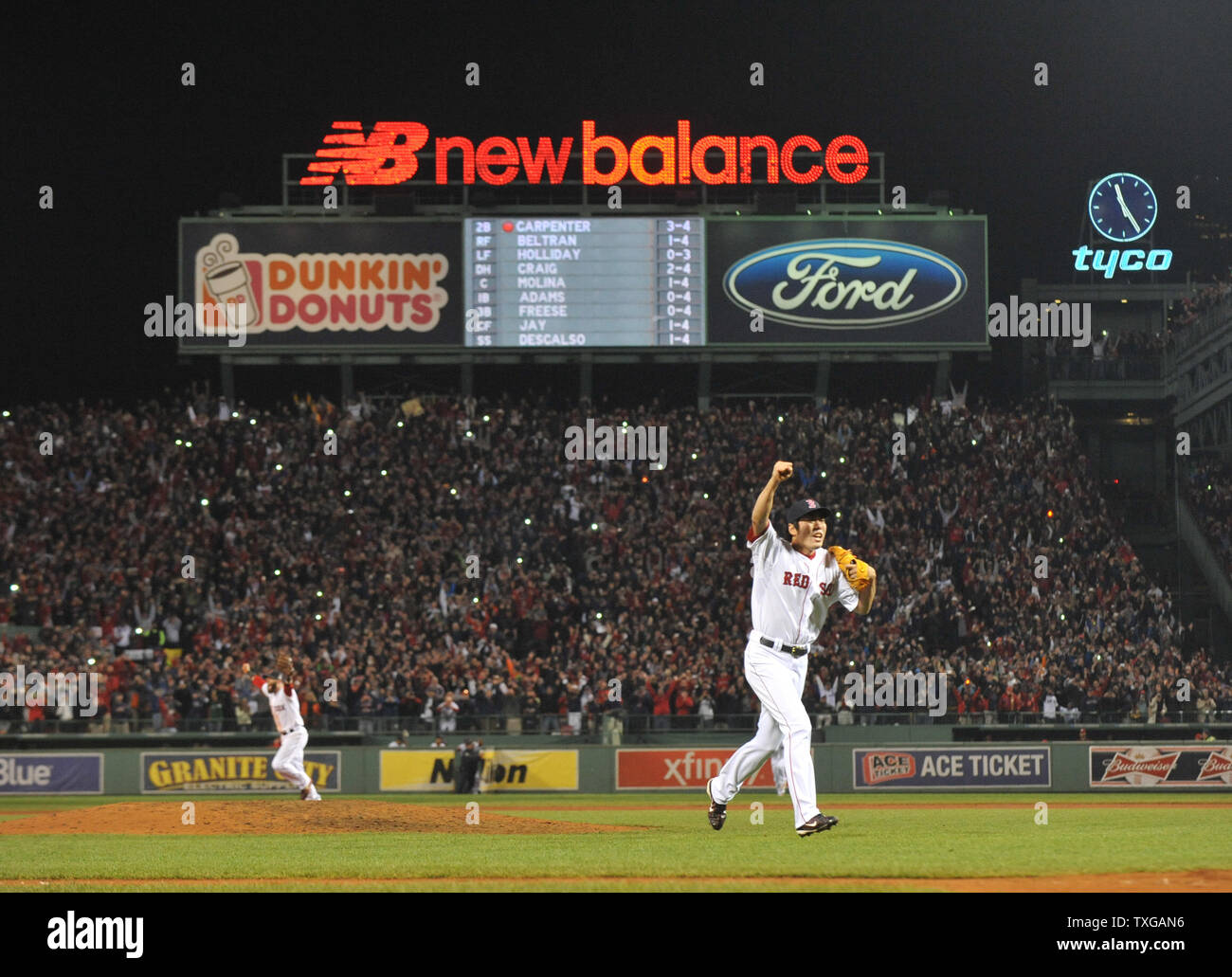 Boston Red Sox closer Koji Uehara holds his son Kazuma as they celebrate on  the field after the Red Sox won the 2013 World Series defeating the St.  Louis Cardinals in game