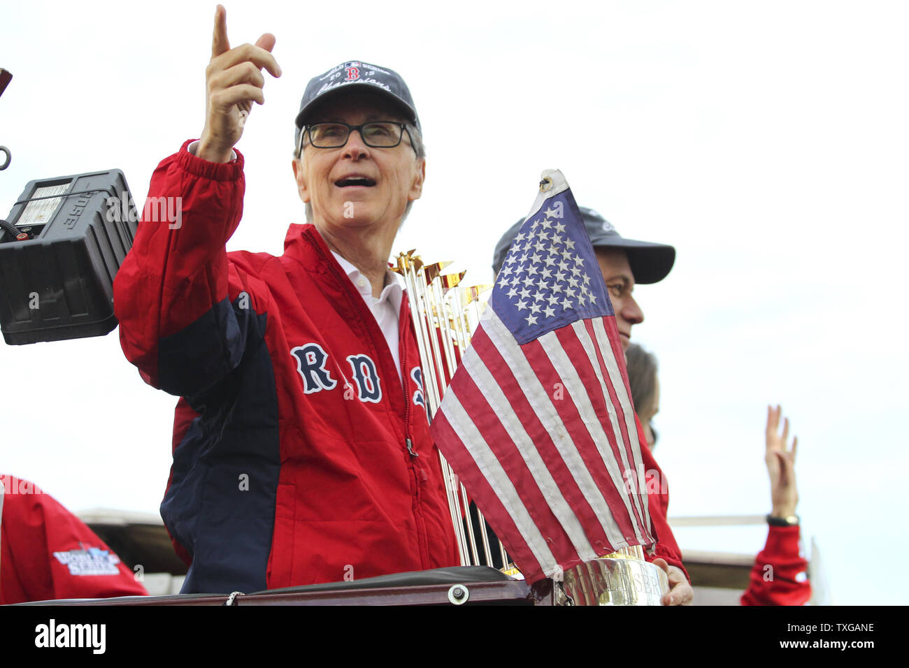 Boston Red Sox principal owner John Henry points to the crowd during a ...