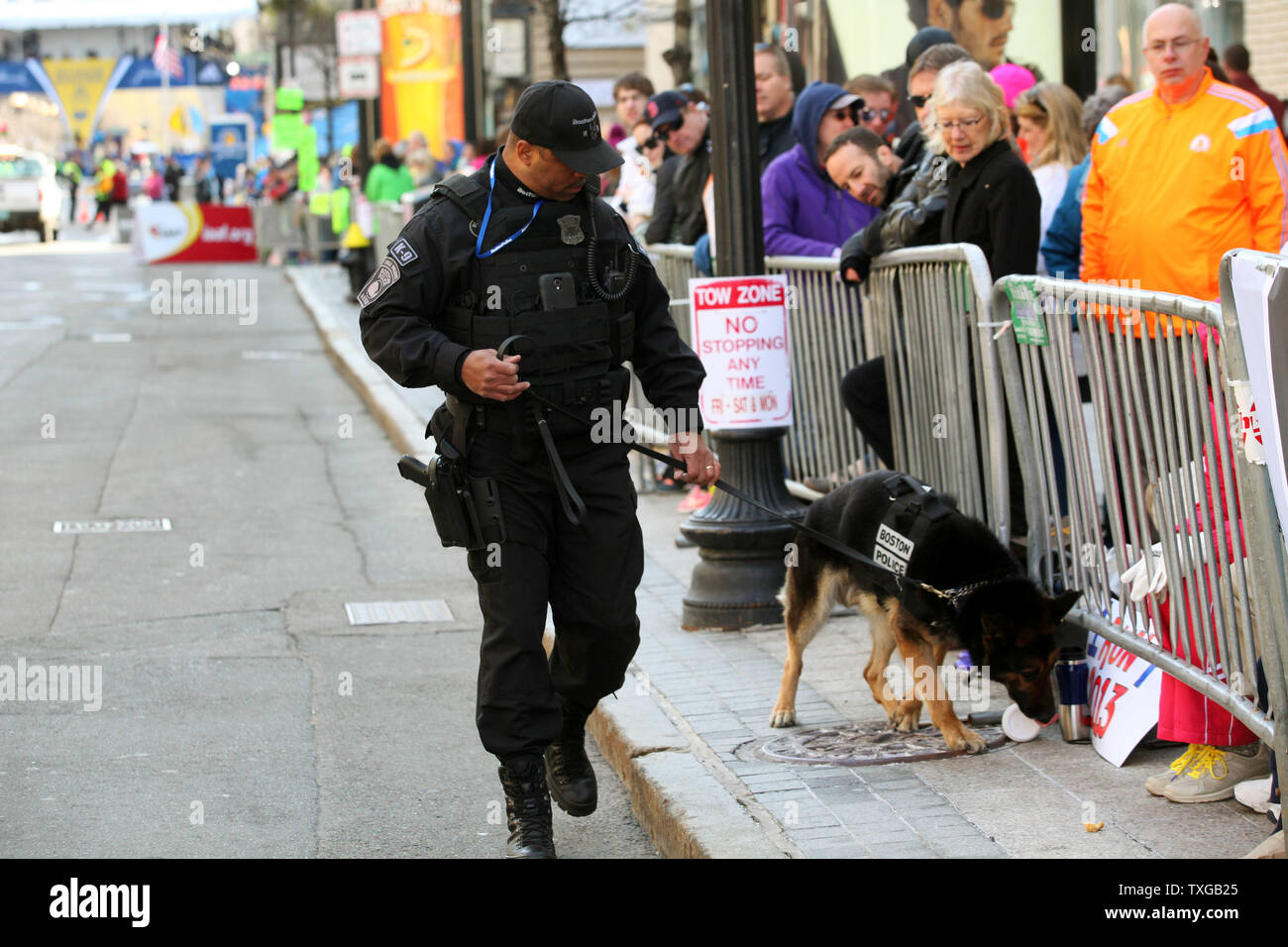 A Police K9 unit walks down Boylston Street near the finish line