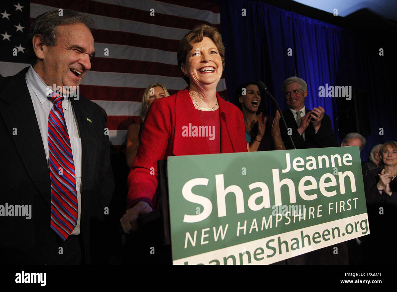 Jeanne Shaheen, incumbent Democratic U.S. Senator in New Hampshire, (R) celebrates with husband Bill Shaheen (L) celebrate her midterm election win over Republican candidate Scott Brown at her election night rally at the Puritan Convention Center in Manchester, New Hampshire on November 4, 2014.    UPI/Matthew Healey Stock Photo