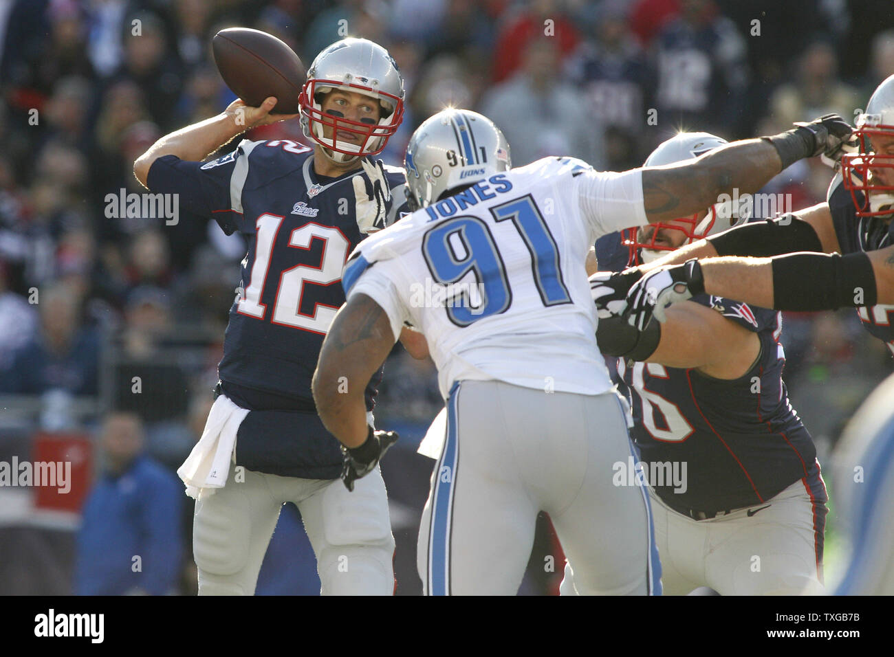 New England Patriots quarterback Tom Brady (12) drops back for a pass in the first half against the Detroit Lions at Gillette Stadium in Foxborough, Massachusetts on November 23, 2014.     UPI/Matthew Healey Stock Photo