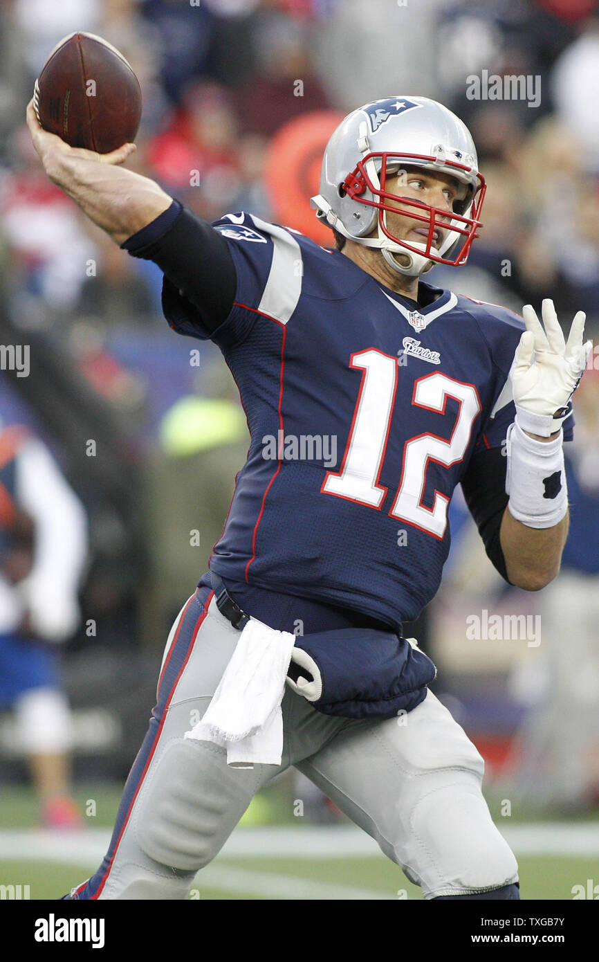 New England Patriots quarterback Tom Brady (12) throws a pass in the fourth quarter against the Detroit Lions at Gillette Stadium in Foxborough, Massachusetts on November 23, 2014. The Patriots defeated the Lions 34-9.   UPI/Matthew Healey Stock Photo