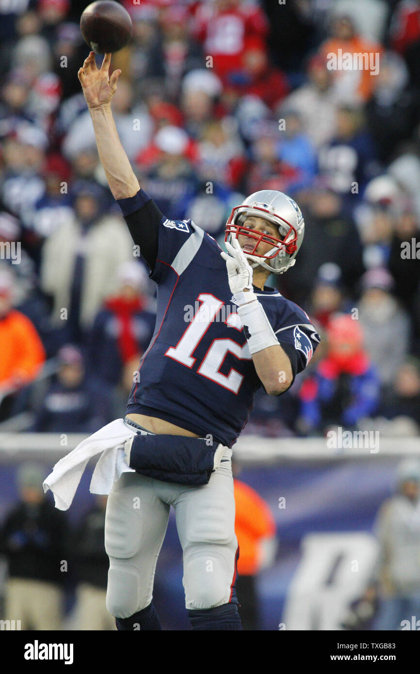 New England Patriots quarterback Tom Brady (12) throws a pass in the third quarter against the Miami Dolphins at Gillette Stadium in Foxborough, Massachusetts on December 14, 2014.  The Patriots defeated the Dolphins 41-13 and clinched the AFC East.   UPI/Matthew Healey Stock Photo