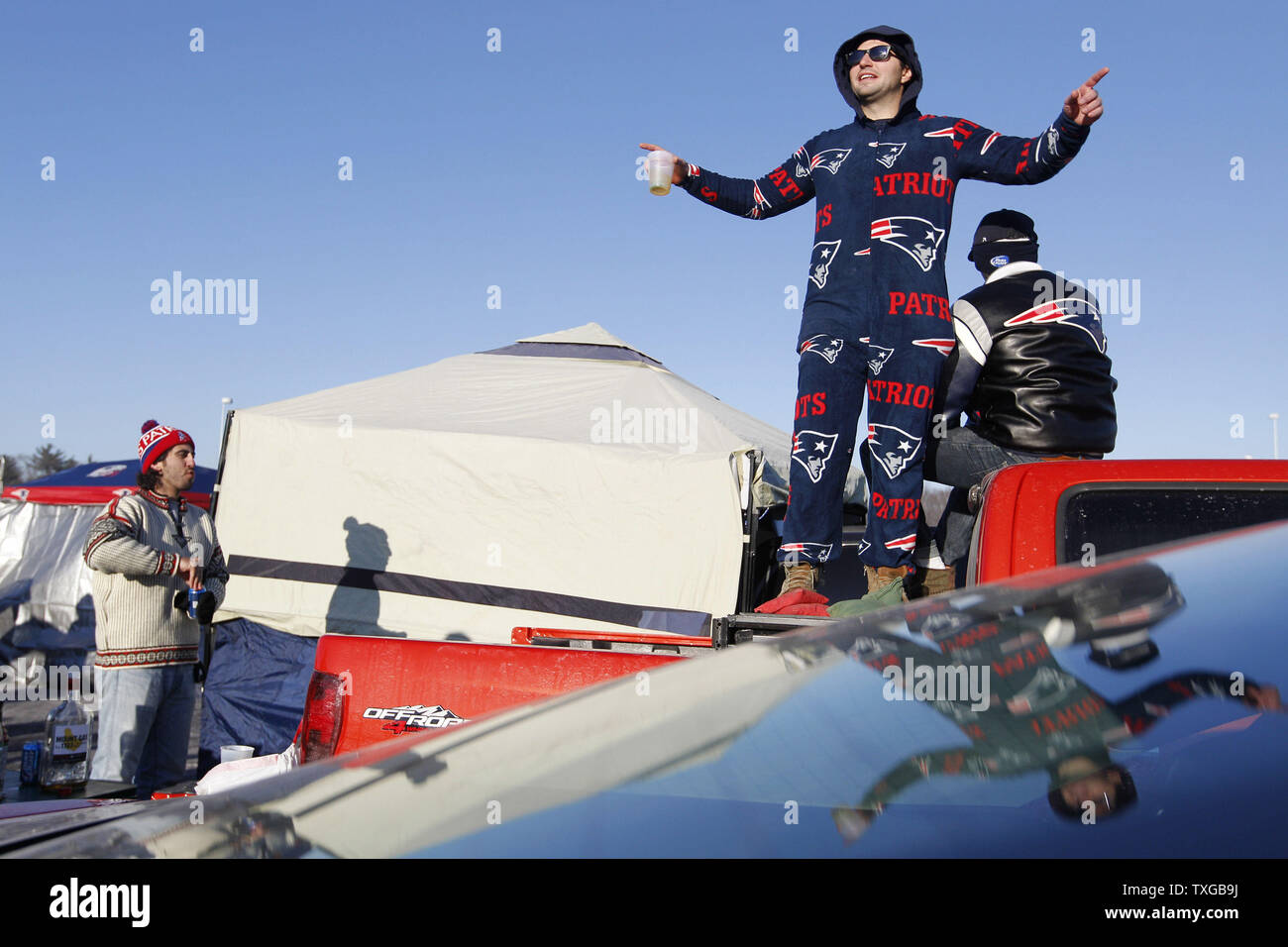 Dillon Vassallo of Boston tailgates with friends prior to the AFC divisional playoff game between the Baltimore Ravens and New England Patriots at Gillette Stadium in Foxborough, Massachusetts on January 10, 2015.  Photo by Matthew Healey/UPI Stock Photo