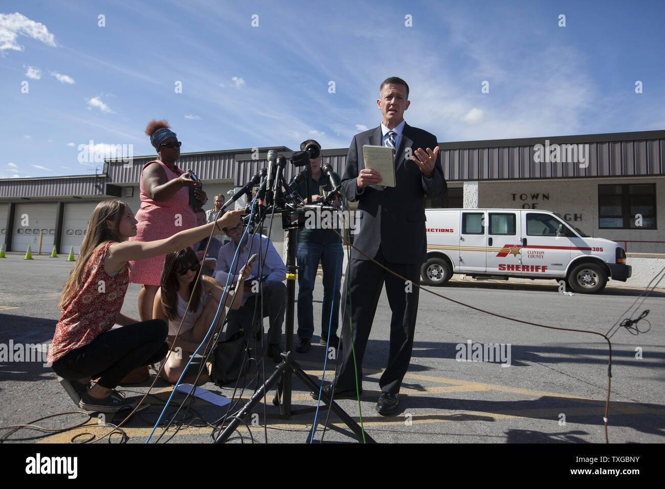 Clinton County District Attorney Andrew Wylie talks to the media about