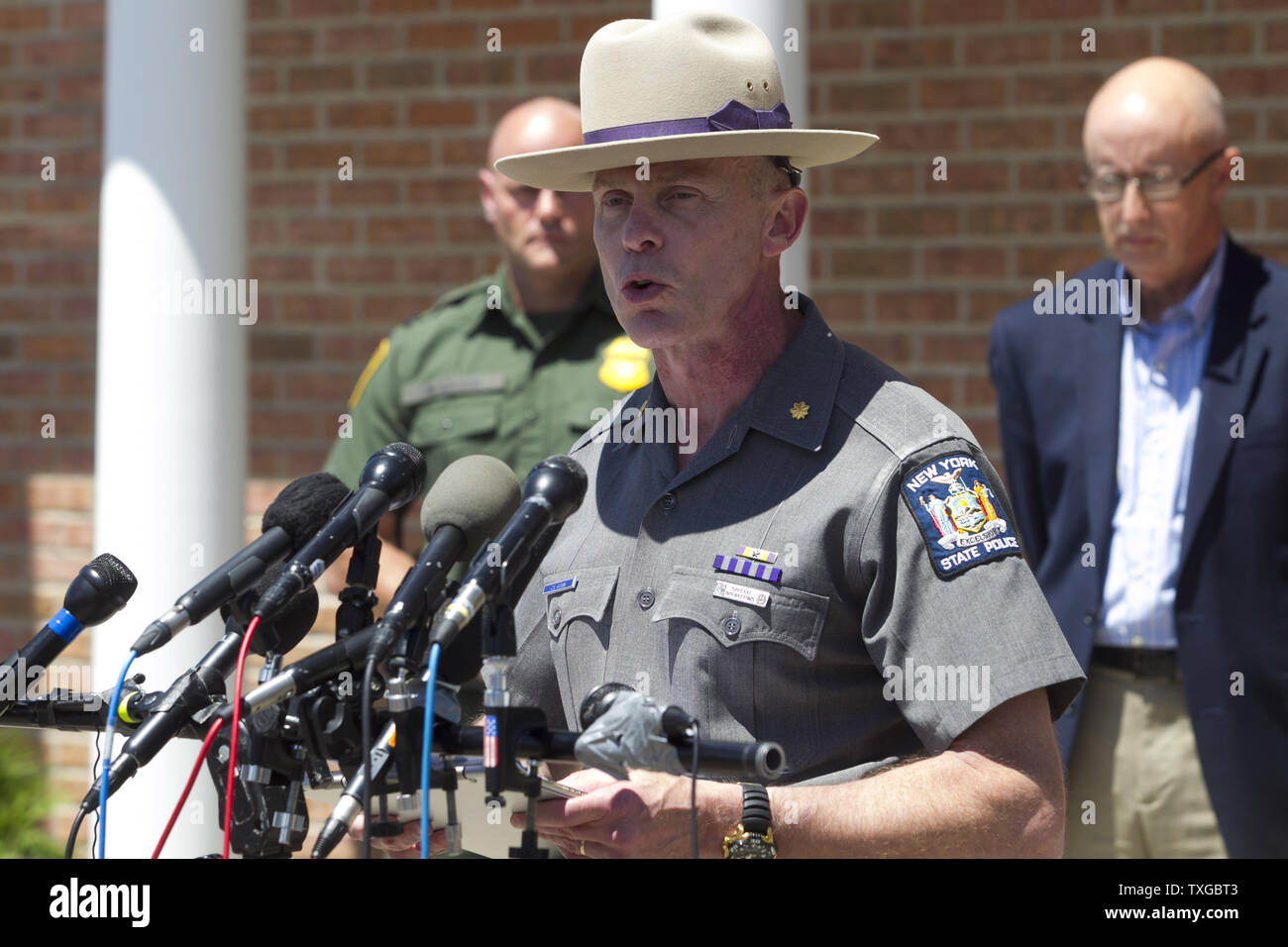 New York State Police Major Charles Guess discusses recent findings in the  ongoing manhunt for two escaped prisoners during a press conference in  front of the State Police Barracks in Malone, New