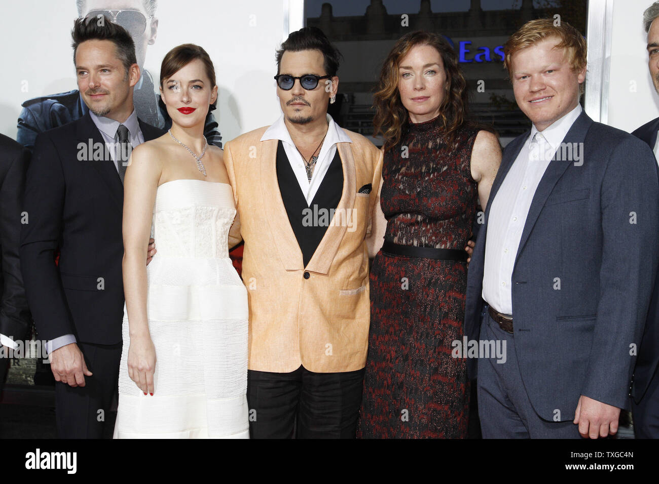 From left Director/Producer of the film "Black Mass" Scott Cooper, actress  Dakota Johnson, actor Johnny Depp, actress Julianne Nicholson and actor  Jesse Plemons, pose for a photo on the red carpet before