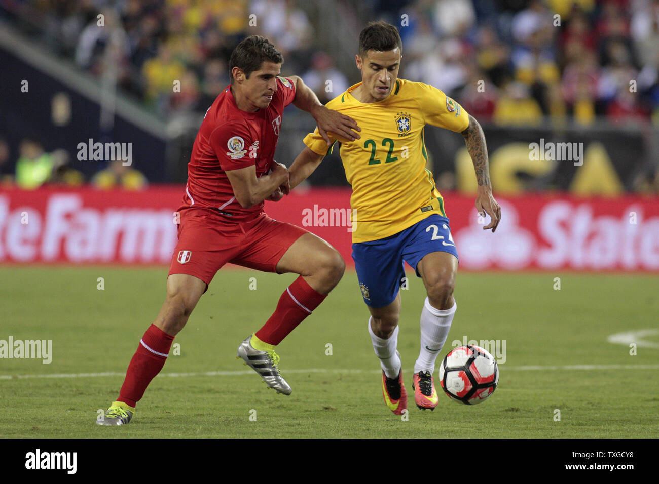 Peru defenseman Aldo Corzo (3) and Brazil midfielder Philippe Coutinho (22) tangle with each other in the first half of the 2016 Copa America Centenario Group B match at Gillette Stadium in Foxborough, Massachusetts on June 12, 2016.  Photo by Matthew Healey/UPI Stock Photo