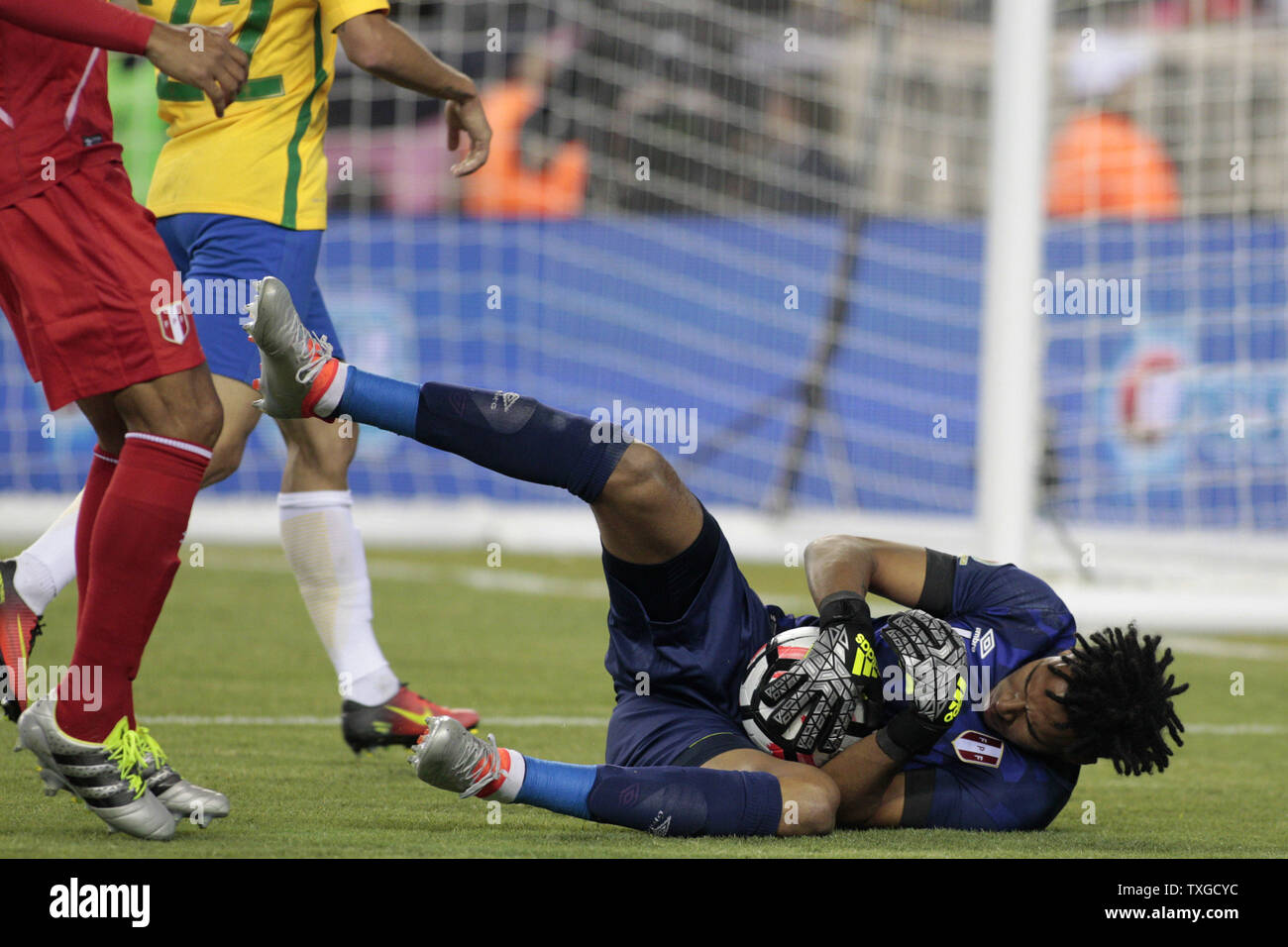 Peru goaltender Pedro Gallese (1) wraps up the ball on a save in the second half of the 2016 Copa America Centenario Group B match against Brazil at Gillette Stadium in Foxborough, Massachusetts on June 12, 2016. Peru defeated Brazil 1-0.  Photo by Matthew Healey/UPI Stock Photo
