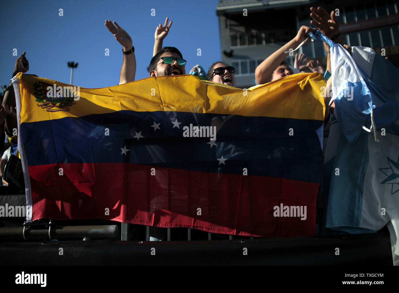 A Venezuela fan waves a flag prior to the 2016 Copa America Centenario quarterfinal match between Argentina and Velezuela at Gillette Stadium in Foxborough, Massachusetts on June 18, 2016.  Photo by Matthew Healey/UPI Stock Photo