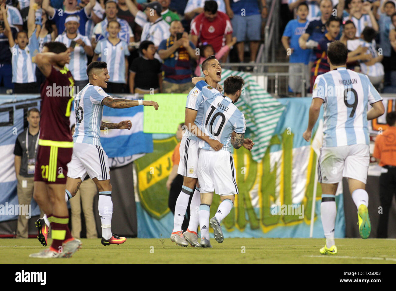 Argentina midfielder Lionel Messi (10) gives a hug to forward Eric Lamela (18) as defender Marcos Rojo (16) and forward Gonzalo Higuain (9) join the celebration after Lamela scored against Venezuela in the second half of the 2016 Copa America Centenario quarterfinal match at Gillette Stadium in Foxborough, Massachusetts on June 18, 2016. Argentina defeated Venezuela 4-1. Photo by Matthew Healey/UPI Stock Photo