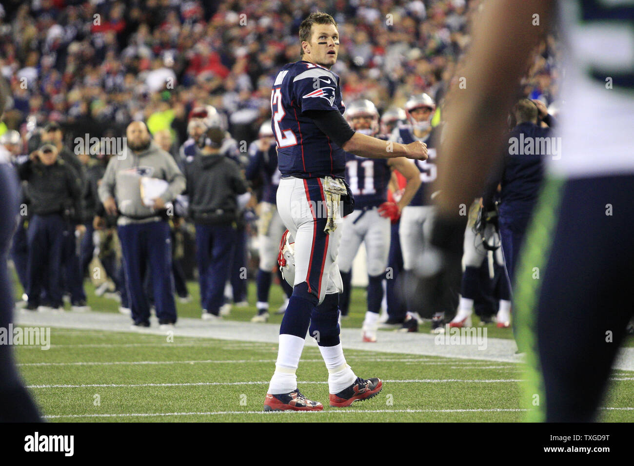 New England Patriots quarterback Tom Brady (12) watches a replay on the  scoreboard after the Seattle Seahawks broke up an end zone pass in the  fourth quarter at Gillette Stadium in Foxborough,