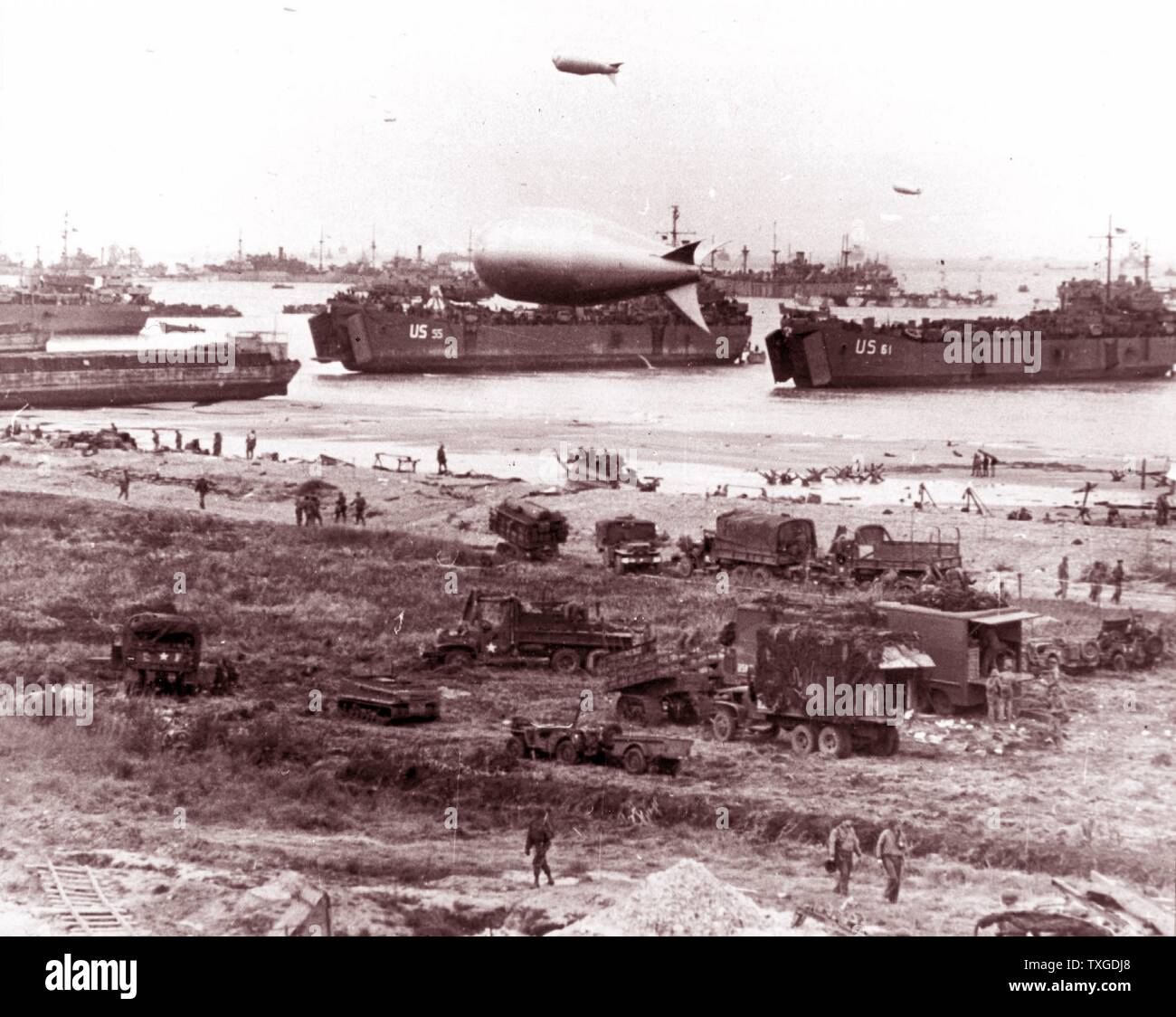 Photograph of D-Day landing vehicles, vessels used to convey a landing force (infantry and vehicles) from the sea to the shore during an amphibious assault. Dated 1944 Stock Photo