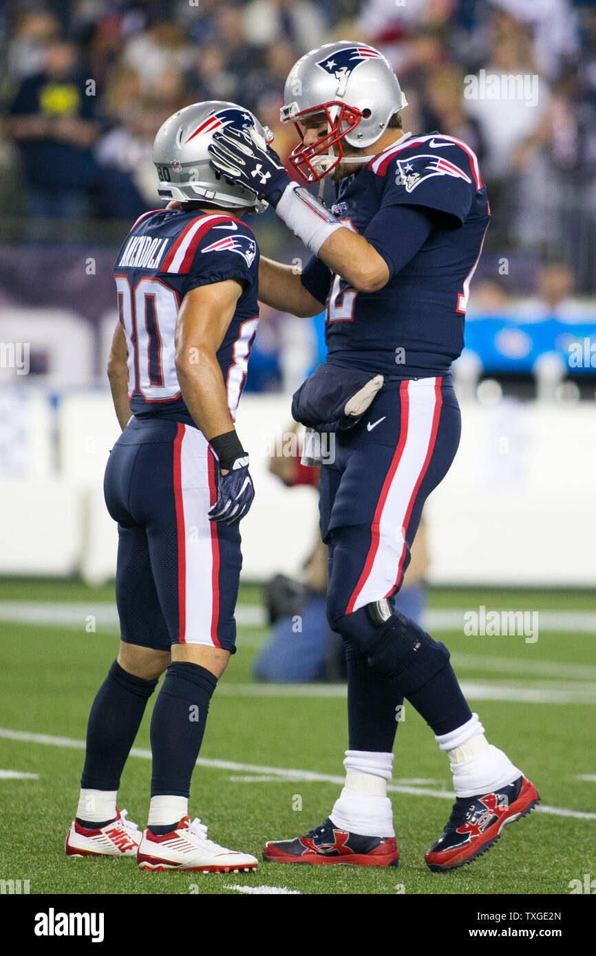 New England Patriots quarterback Tom Brady greets members of the U.S.  military along the sideline before an NFL football game against the Atlanta  Falcons, Sunday, Oct. 22, 2017, in Foxborough, Mass. (AP