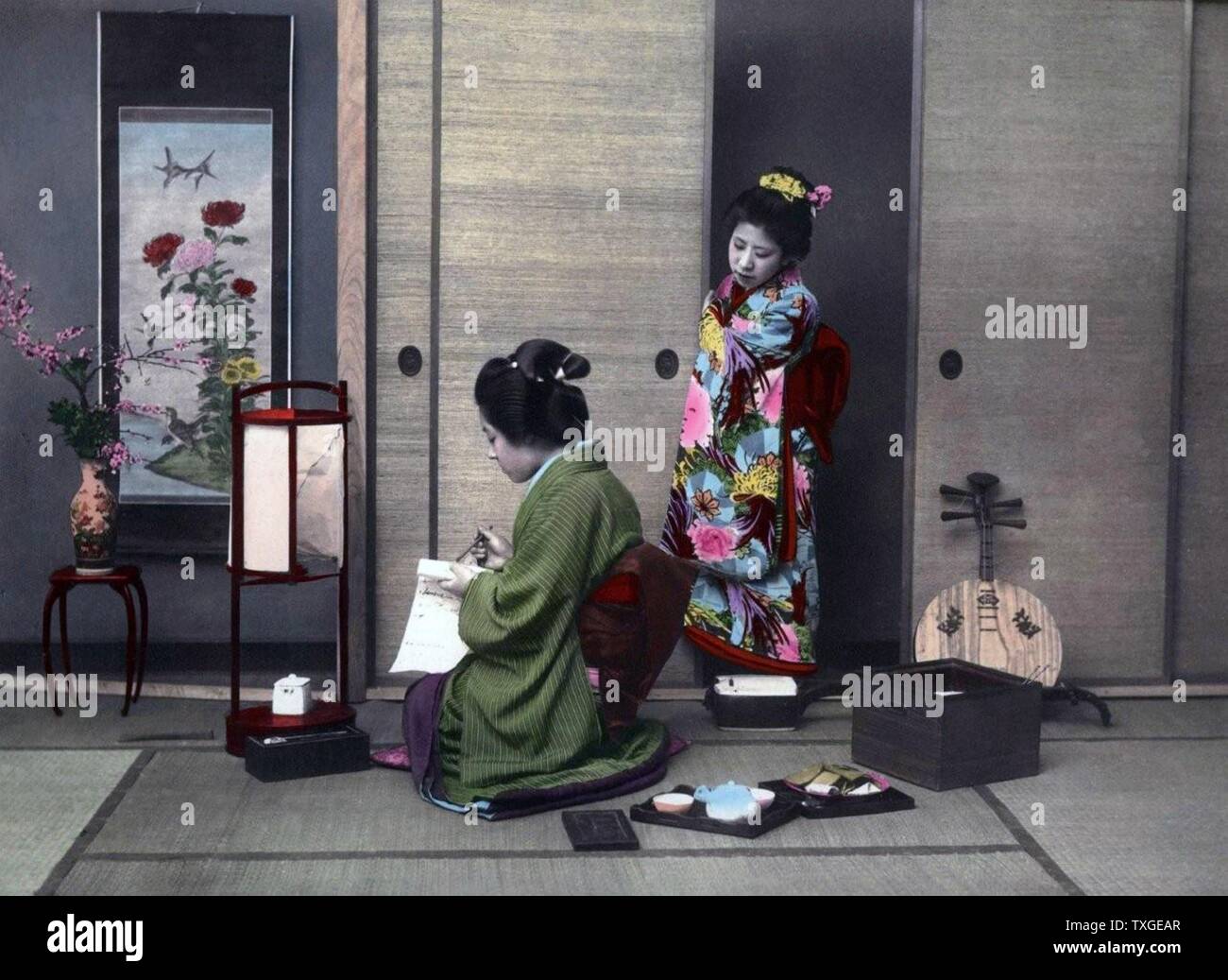 Hand-coloured photograph of Japanese women by Felice Beato (1832-1909) Italian-British photographer. Dated 1869 Stock Photo