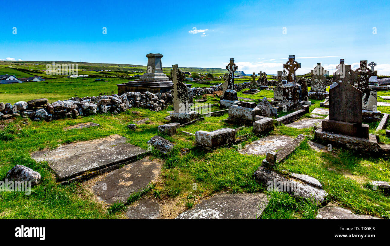 Ruined graveyard of medieval Killilagh church in the village of Doolin ...