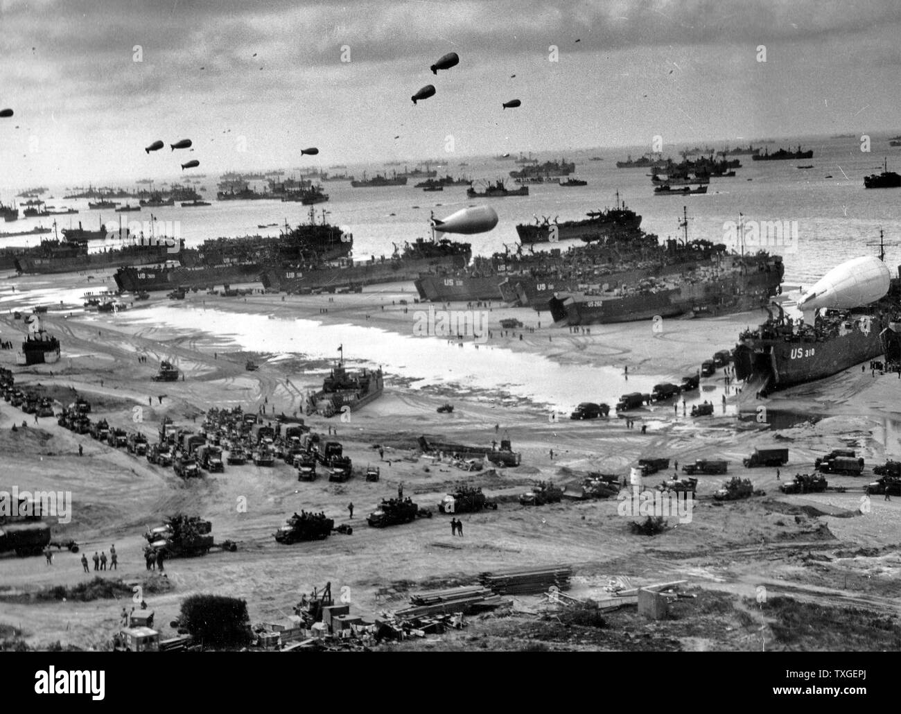 Photograph of D-Day landing craft, boats and seagoing vessels used to convey a landing force (infantry and vehicles) from the sea to the shore during an amphibious assault. Dated 1944 Stock Photo