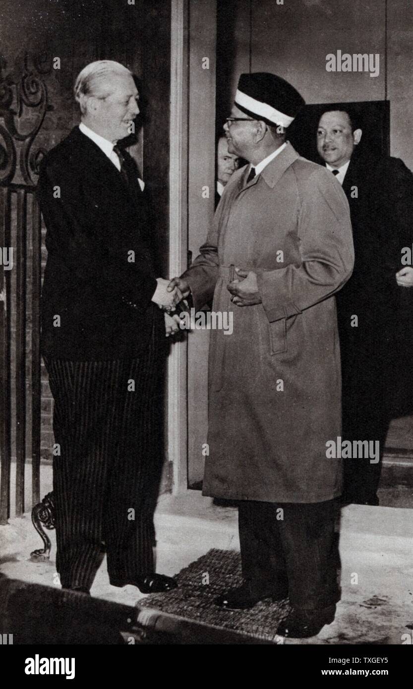 Tenku Abdul Rahman (Prime Minister of Malaysia, leaves 10 Downing Street, London after meeting with Harold Macmillan. He is followed by Pakistani President Ayub Khan 1960 Stock Photo