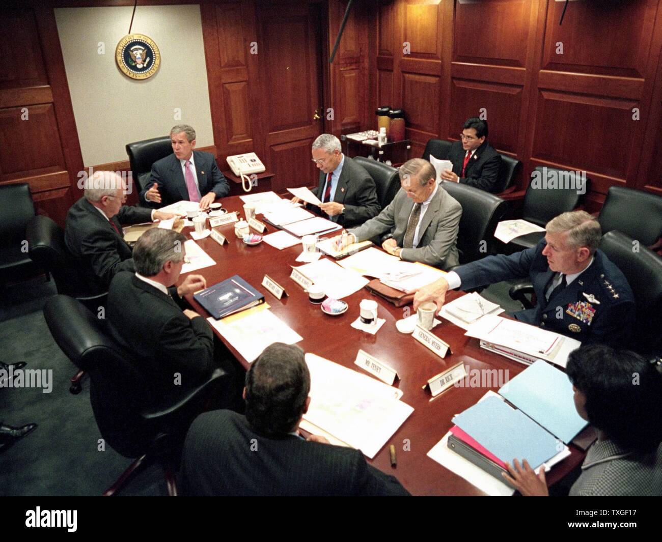 President George W Bush, meets with top security and government officials, in the White House situation Room, during the aftermath days following the September 11th 2001 terrorist attacks, on US Cities (9/11) Stock Photo