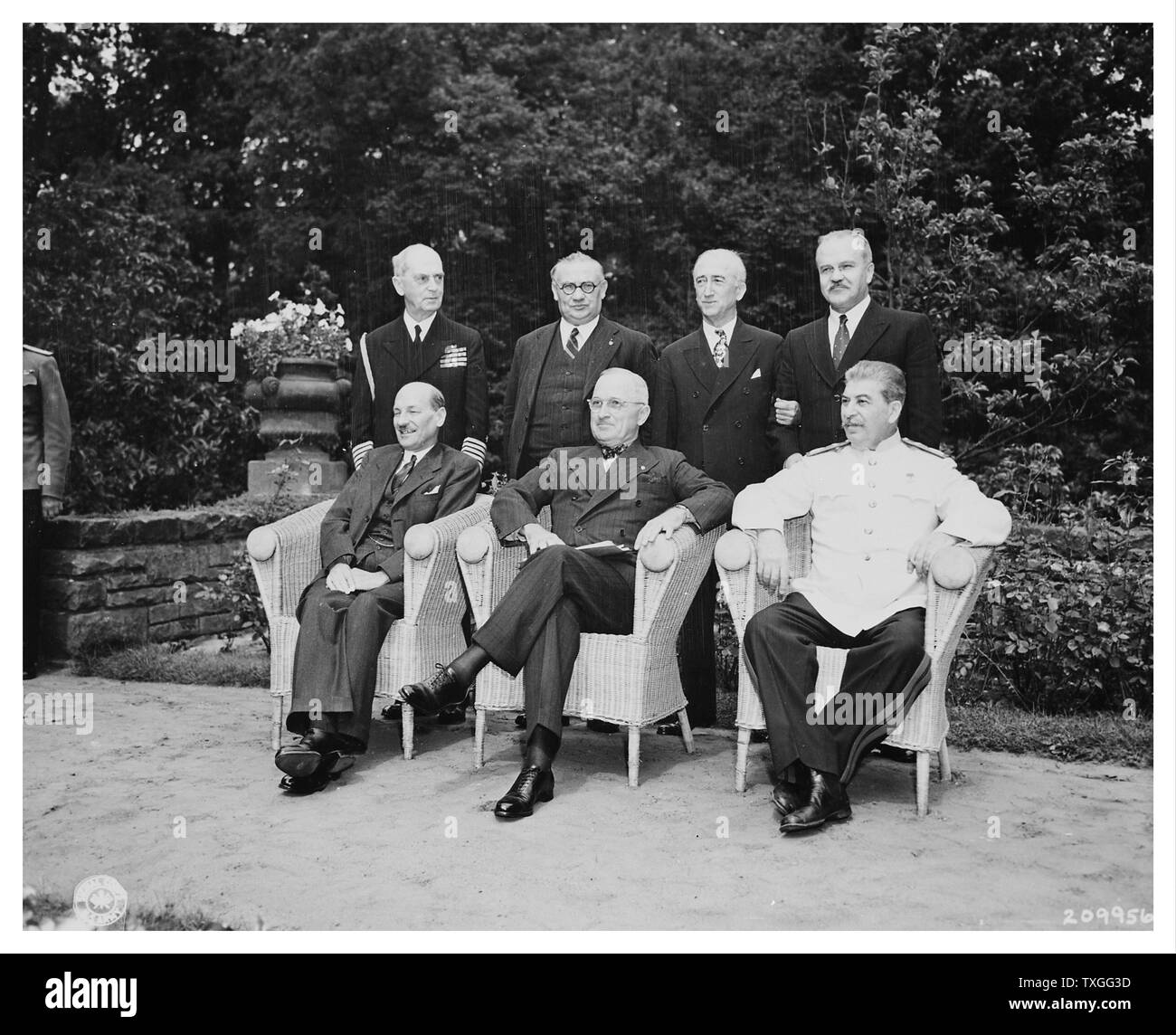 Potsdam ( Berlin ) conference, 1945. the three Allied Powers: USSR, Great Britain and the United States. left to right seated; Clement Attlee, Harry Truman, Joseph Stalin. Standing L to R: Admiral J.D. Loahy, Ernest Bevin, J.W.Byrnes and Russian Foreign Minister Molotov Stock Photo