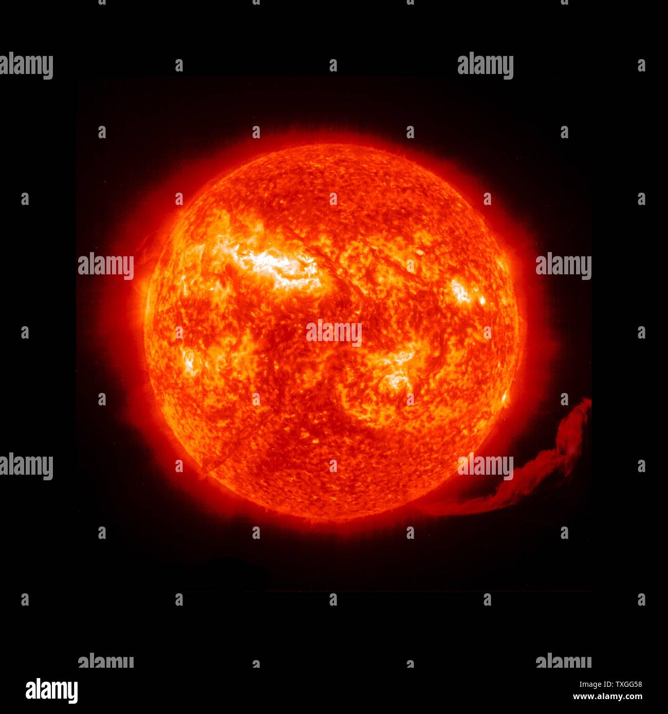 An eruption of solar material exploding up off the surface of the right side of the sun, 2012 Stock Photo