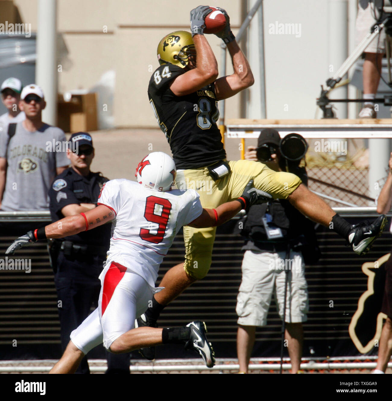 Colorado Buffaloes Tyson DeVree (84) hauls in a one yard touchdown pass behind Miamia of Ohio Redhakws line backer Clayton Mullins in the first quarter at Folsom Field in Boulder, Colorado on September 22, 2007.  (UPI Photo/Gary C. Caskey) Stock Photo