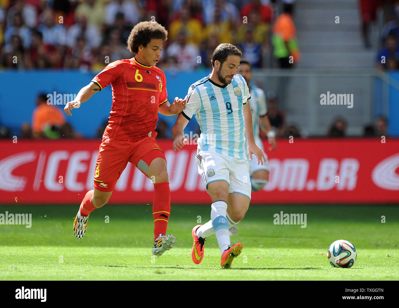 Gonzalo Higuain of Argentina competes with Axel Witsel (L) of Belgium during the 2014 FIFA World Cup Quarter Final match at the Estadio Nacional in Brasilia, Brazil on July 05, 2014. UPI/Chris Brunskill Stock Photo