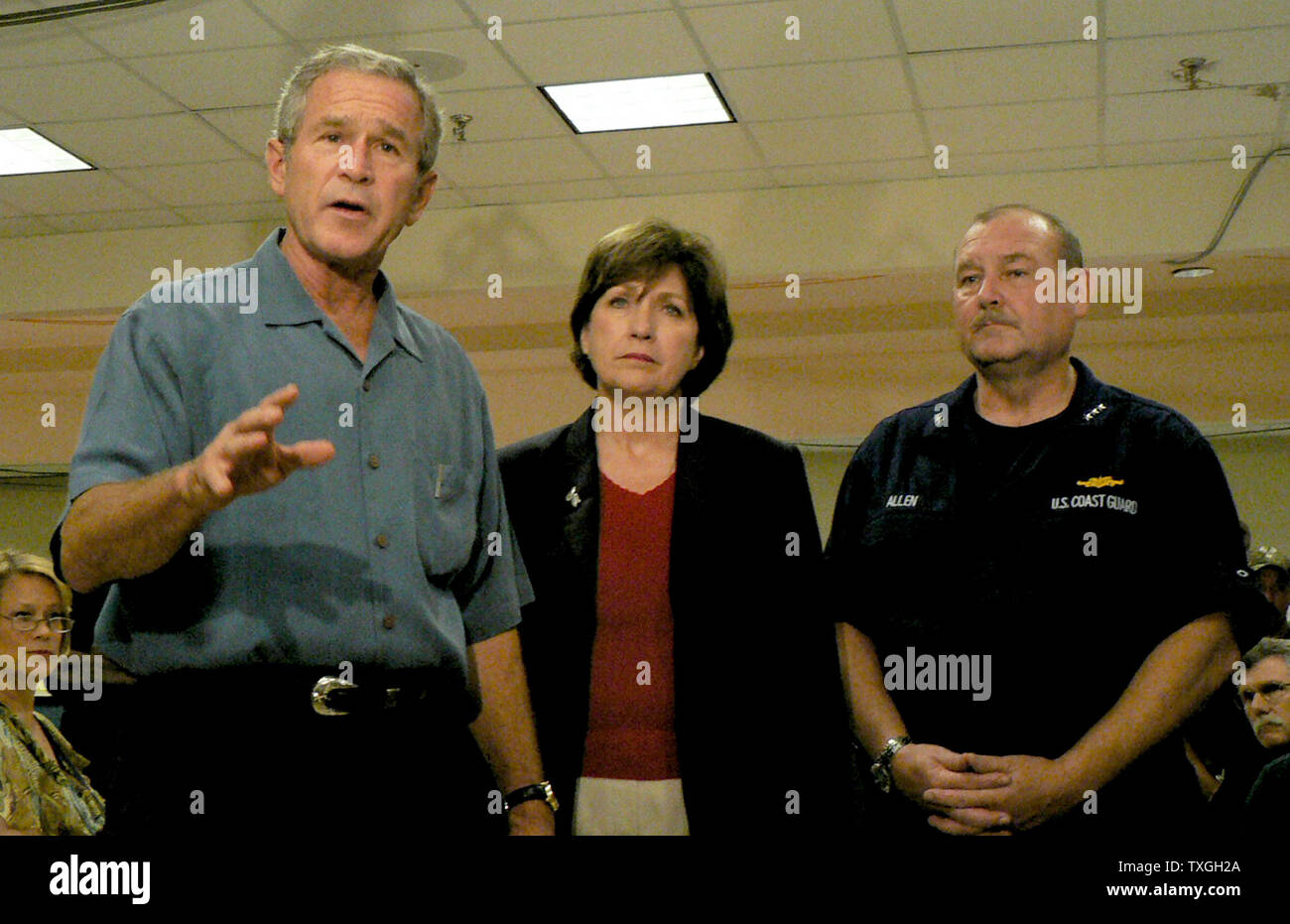 President George Bush speaks in front of Louisiam Gov Kathleen Blanco and FEMA's Thad Allen while visiting the FEMA offices in Baton Rouge, LA, on September 25, 2005. Bush visited the FEMA field office the day after Hurricane Rita made landfall.  (UPI Photo/James Terry III) Stock Photo