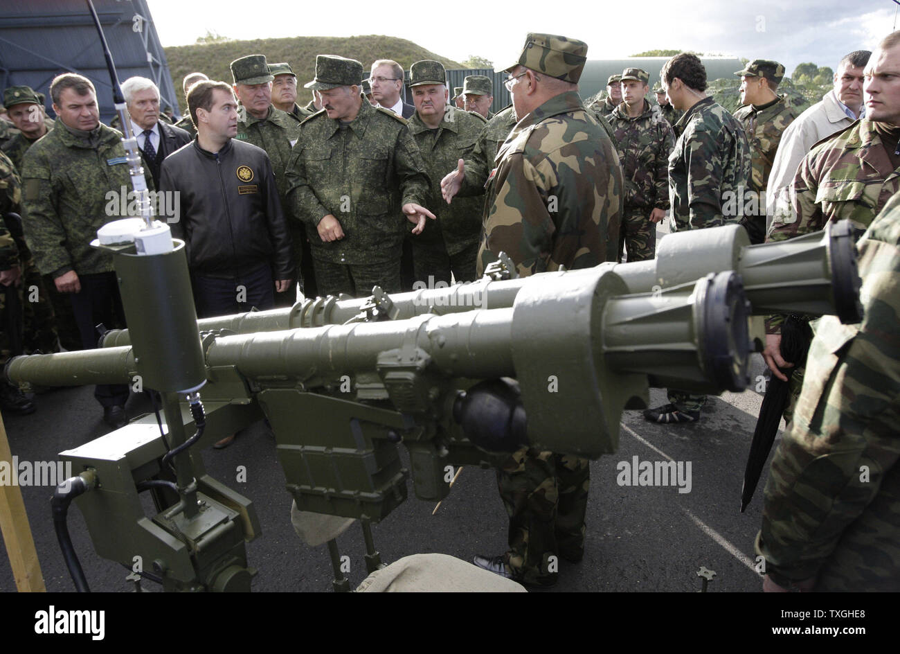 Russian President Dmitry Medvedev (2nd L) listens to Belorussian President Alexander Lukashenko as they inspect current and prototype military equipment  during the final stage of Zapad-2009 (West 2009) Russian-Belarus joint military exercises near Brest in western Belarus on September 29, 2009. UPI/Anatoli Zhdanov Stock Photo