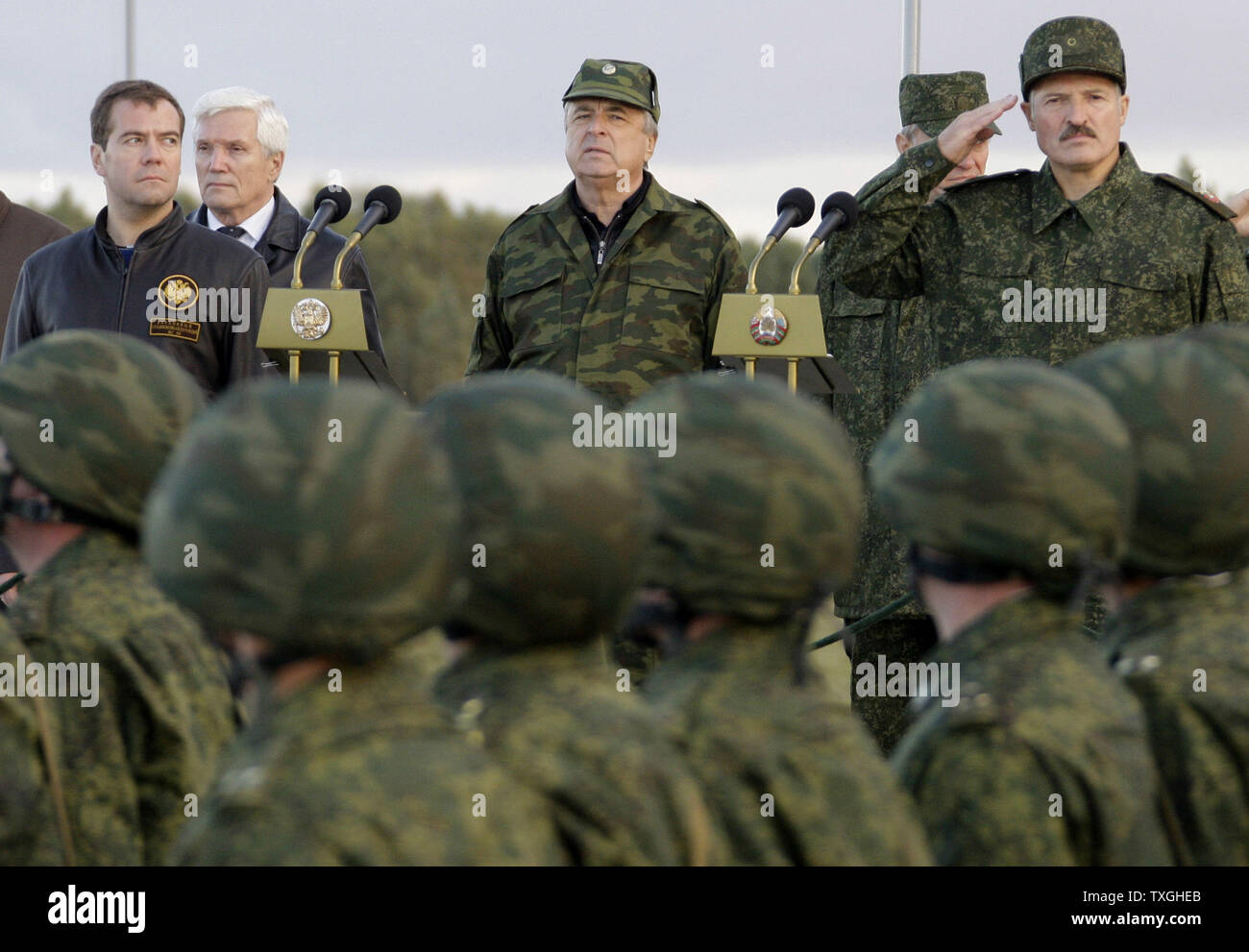 Russian President Dmitry Medvedev (L) and Belorussian President Alexander Lukashenko (R) review the troops after observing the final stage of Zapad-2009 (West 2009) Russian-Belarus joint military exercises at at Obuz-Lesnovsky training range near Brest in western Belarus on September 29, 2009. UPI/Anatoli Zhdanov Stock Photo