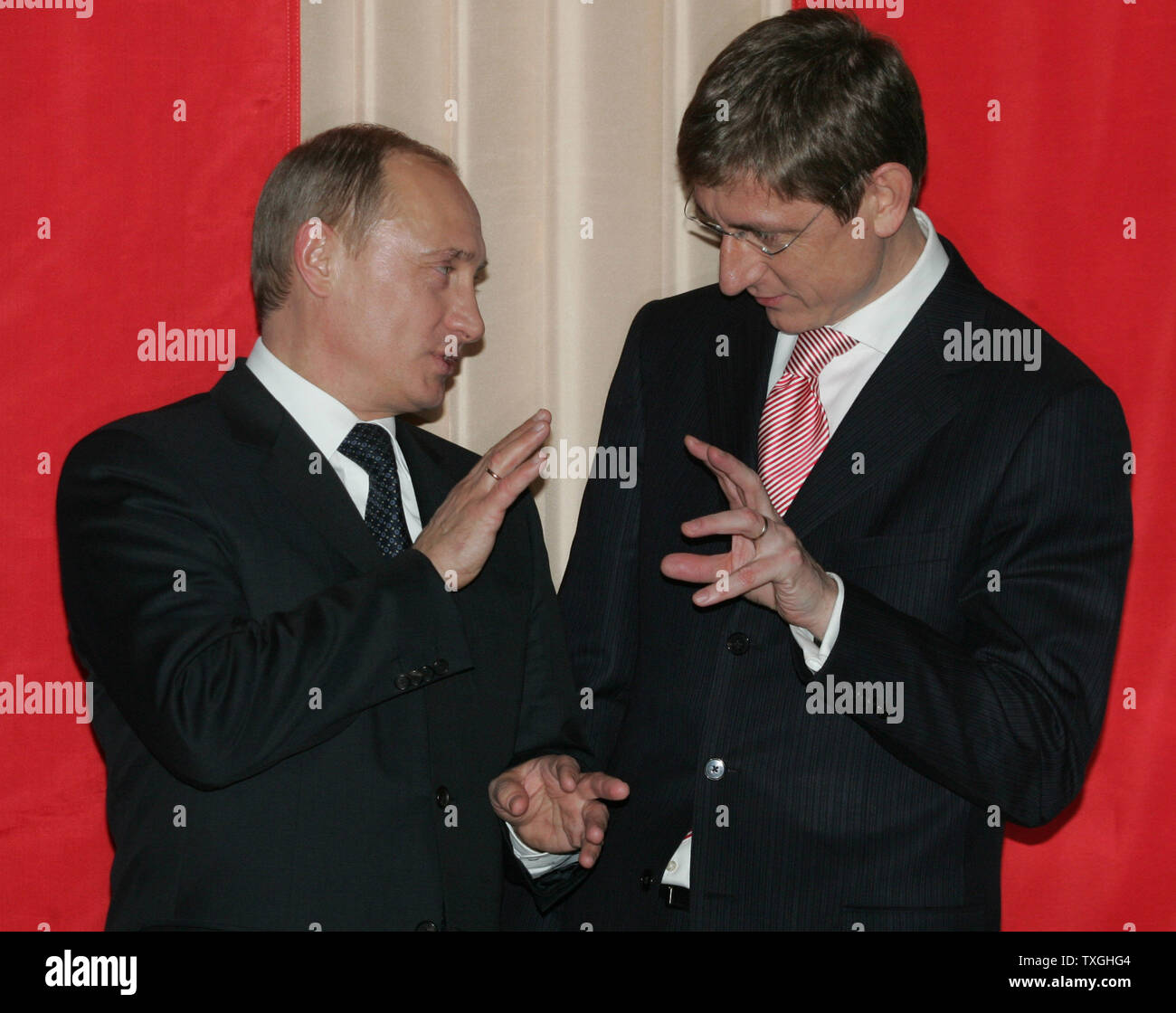 Russian President Vladimir Putin (L) and Hungarian Prime Minister Ferenc Gyurcsany talk before their meeting in Budapest, February 28, 2006. Putin visited Hungary to discuss economic and energy issues. (UPI Photo/Anatoli Zhdanov) Stock Photo